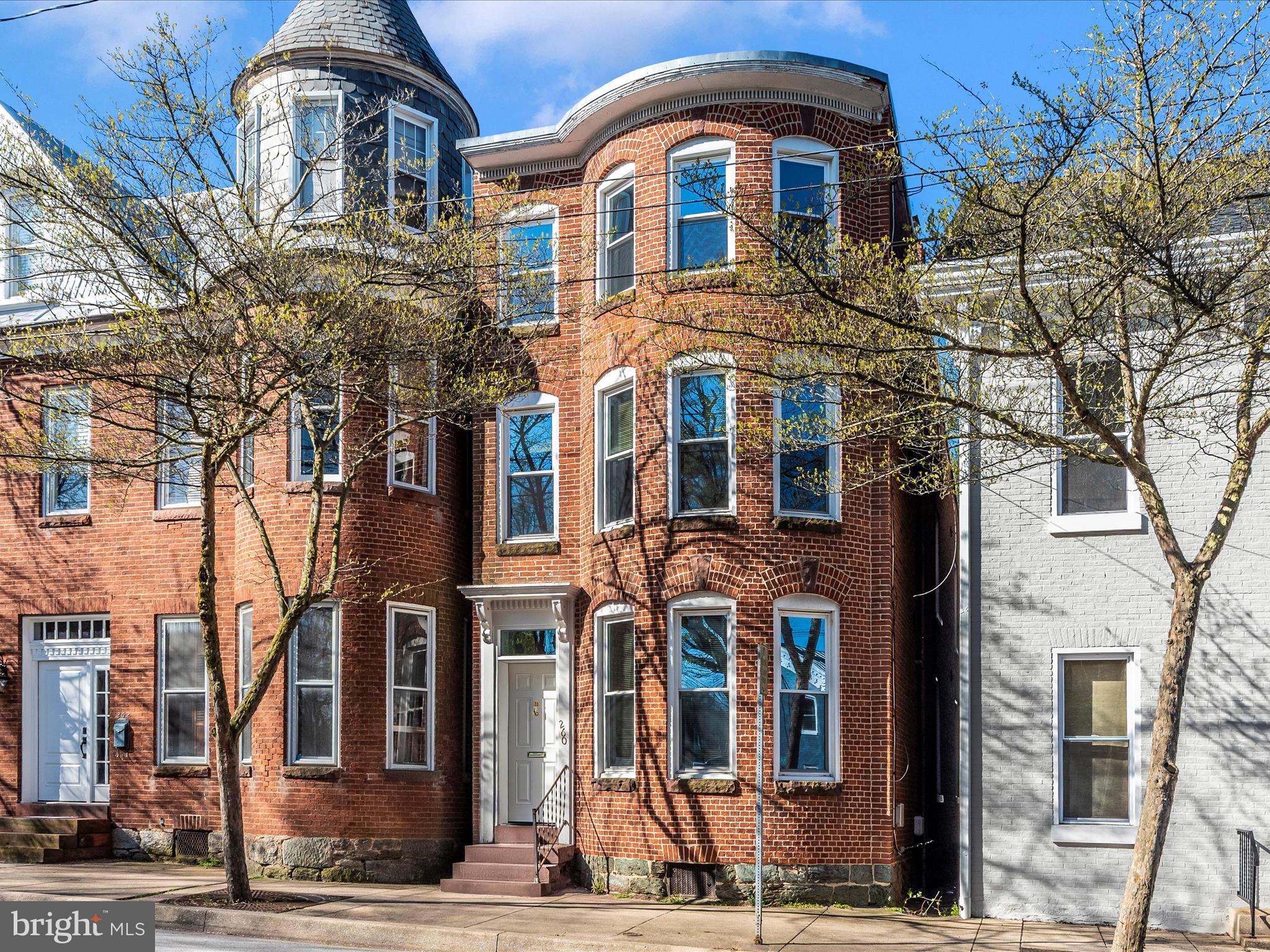 Welcome to 260 E Main Street - where historic charm meets modern comfort in the heart of downtown Westminster! This beautifully maintained, detached home offers spacious living across four levels. Step inside to soaring ceilings, tall windows, and gleaming wood floors that fill the space with warmth and natural light. The main level features a generous living area, a well appointed kitchen with island, a convenient half bath, and laundry area with access to the backyard - perfect for entertaining or relaxing outdoors. Upstairs, you'll find two spacious bedrooms and two full baths, including a sun-drenched primary suite complete with a walk-in closet and large private bath. The top level offers a third bedroom and multiple storage areas, providing flexibility for guests, a home office, or creative space. Experience the charm of historic Westminster with shops, dining, and modern conveniences just steps away. This is downtown living at its finest!