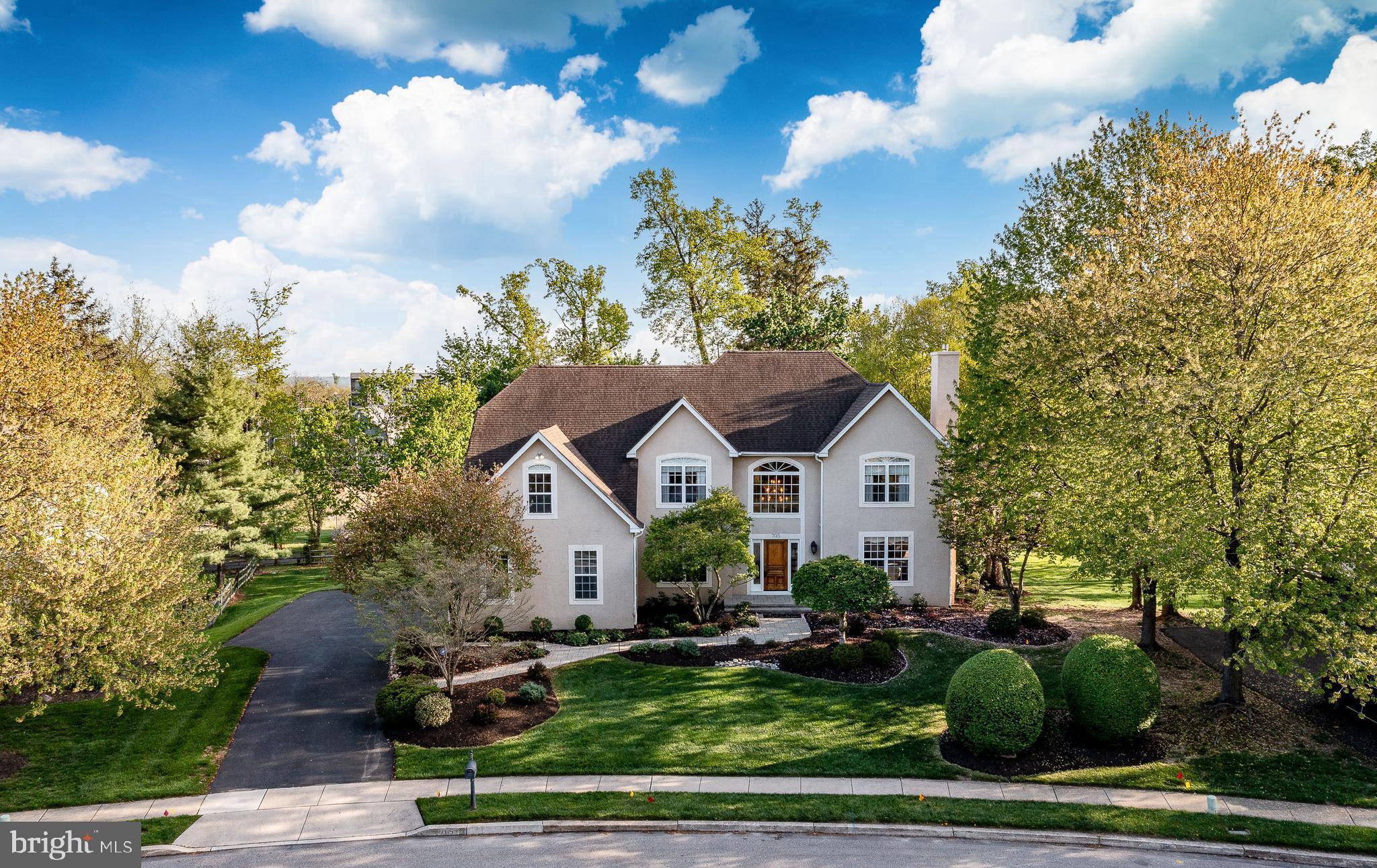 Welcome to 705 Lake Drive in Ambler - You are welcomed by the manicured front gardens and beckoned down the pathway to the inside where layout, upgrades, and a beautiful quiet yet convenient location come together seamlessly. This updated 4/5 bedroom, 4.5-bath home offers the perfect blend of comfort and functionality in a highly sought after and walkable location.
A dramatic two-story foyer sets the tone upon entry, complemented by both an elegant front and back staircase for ease and flow and beautiful hardwood floors and moldings. A private home office with French doors and custom built-ins, provides the perfect space for remote work or quiet study. The bright, open layout is highlighted by a light-filled family room with vaulted ceilings with skylights, a gas fireplace, and wet bar, creating a bright and airy inviting atmosphere ideal for everyday living and entertaining.
The updated gourmet kitchen features quartz countertops, high-end stainless steel appliances, a seated island, ample custom cabinetry, and a layout designed for both daily living and effortless entertaining. The kitchen opens to a breakfast room where glass doors open to an expansive deck overlooking trees, gardens and a serene walking trail - perfect for morning coffee, outdoor dining, or simply enjoying the peaceful natural setting.
The large formal living room has a gas fireplace with a stunning antique mantel surround and the spacious dining room with butlers pantry allows for effortless entertaining, offering the perfect setting for gatherings both intimate and grand.
Upstairs, the spacious primary suite offers a true retreat with multiple large custom outfitted walk-in closets and a luxurious updated en-suite bath complete with a soaking tub, double vanities, and a walk-in shower with frameless glass doors and custom tile work. A second bedroom suite includes its own private updated full bath with custom tile work, while two additional bedrooms share an updated hall bath with double vanity, and tub/shower combo providing a functional and flexible layout for family and guests.
The walk out daylit lower level adds exceptional living space, featuring a dedicated home theater along with additional room for a gym, playroom, or lounge.  A beautifully renovated full bathroom with tub/shower combo and bonus room currently a bedroom adds to the versatility of the lower level.
With its scenic backdrop, thoughtful layout, and extensive updates throughout, this home offers a rare opportunity to enjoy privacy and comfort just minutes from everything Ambler has to offer. Just a 15 min walk to vibrant downtown Ambler, a lively walkable town with acclaimed dining, shopping, and cultural attractions including the historic Ambler theater. Close to Upper Dublin High School and Fort Wash Elem making daily routines simpler. Close to parks and trail amenities, Mondauk Common’s 1 mile walking track trails and playgrounds, Upper Dublin’s trail and park system. The borough’s revitalized streetscape and strong sense of community offer a lifestyle that blends charm with modern convenience.
Equally compelling is the home’s proximity to the iconic Mattison Estate, a landmark property that enhances the surrounding area’s character, architectural integrity, and long-term desirability.
For commuting professionals, the location provides efficient access to Center City Philadelphia, major corporate corridors, and regional rail service—supporting a seamless balance between career and home life.