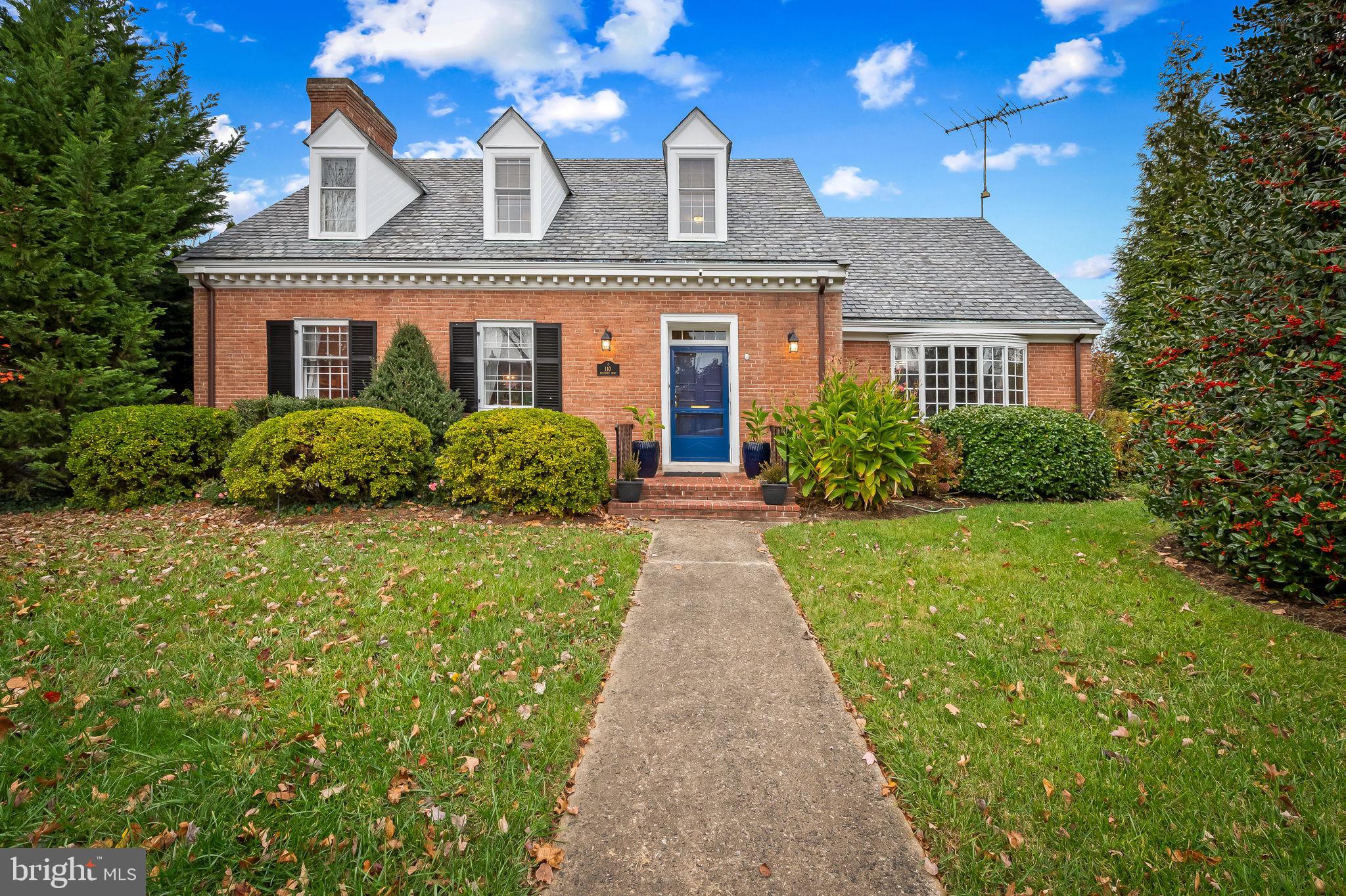 Beautifully maintained  brick Cape Cod with a coveted first level primary suite and a spacious 2-car garage and covered access to the home via a screen porch.  Offering 3 bedrooms, 2 full baths and 2  updated half baths,  and so many comfortable, spacious living areas on all levels.  The large living room has a wood-burning fireplace, a formal dining room offers two corner cabinets, and the very spacious kitchen is complete with a large island and breakfast bar, stainless steel appliances and ample, beautiful cabinets throughout. The first level primary suite has an updated en suite bath and is adjacent to a gorgeous library/family room  with beautiful built-ins and can also serve as a great home office.  The upper level has two bedrooms, another full bath, two cedar closets and a wonderful walk-in attic  which could be easily renovated for additional living area or used as is for convenient storage.  Last but not least, the renovated and lower level is a surprise with a great recreation, fitness or family room along with a bright laundry center with more storage and an earmarked craft area.  The rear yard is lovely for gardening and entertaining. This is home which has to be seen in person to fully appreciate! Easy access to the home via the one of two lanes off of Northern which connect you to the home's large driveway.