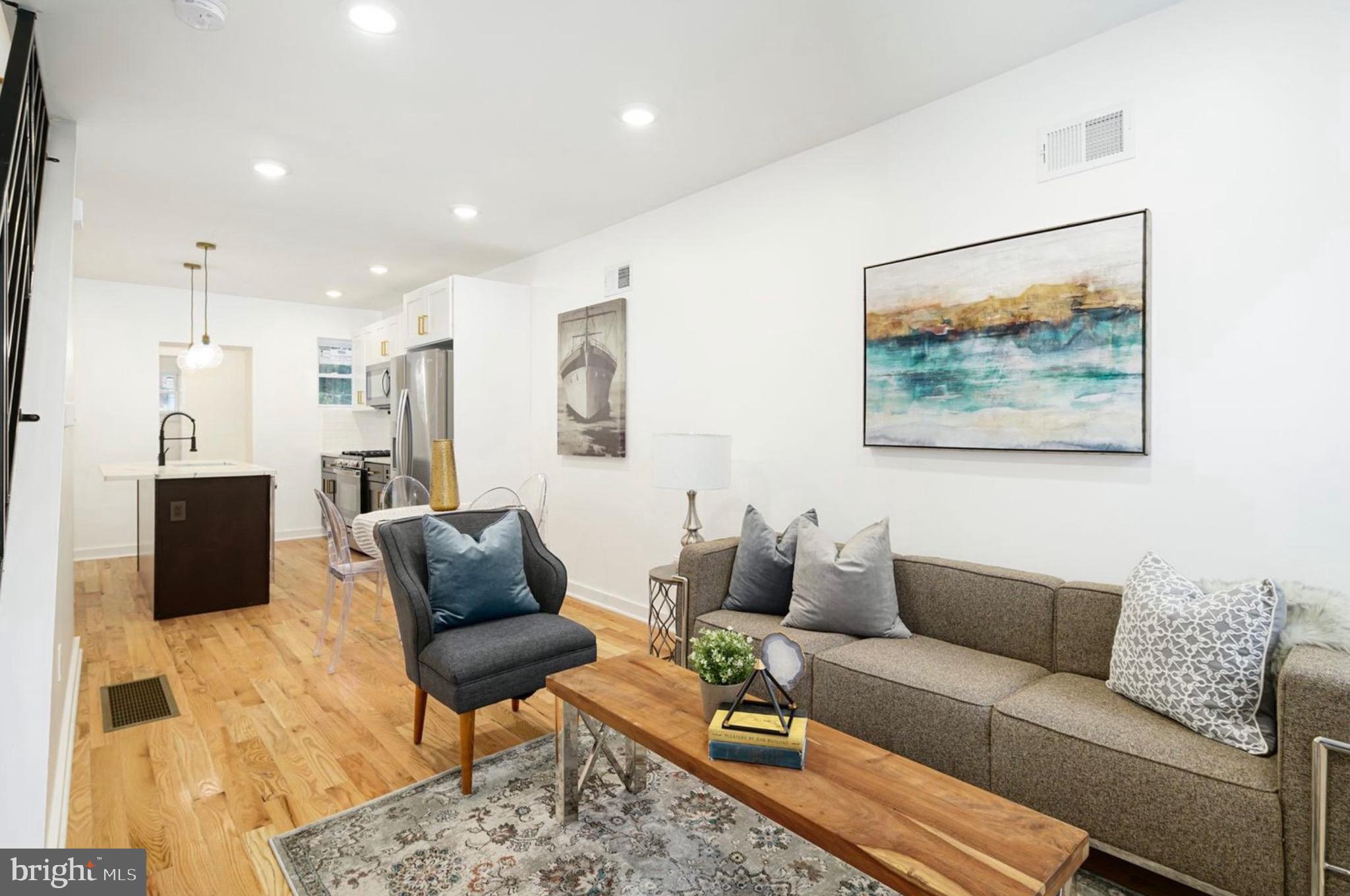 This 2 bedroom 2.5 bathroom fully renovated end of row townhome in Brewerytown has it all! Enter to a spacious living area with tiled foyer and oak flooring which flows from the living room, through the dining area, and into the kitchen. The kitchen is equipped with new stainless steel appliances, shaker cabinets, and quartz countertops. Laundry and half bath placed conveniently on the main level. Upstairs are two bedrooms and two full bathrooms. The primary bathroom has a spacious walk-in shower and light up LED mirrors. The unfinished basement provides ample storage space. Outside you’ll find a fenced in backyard with concrete patio for entertaining and grassy area for pets. The home is protected with a simply safe security system. Conveniently located by the rapidly-redeveloping W. Girard Ave, Fairmount Park, I-76, and SEPTA transit.