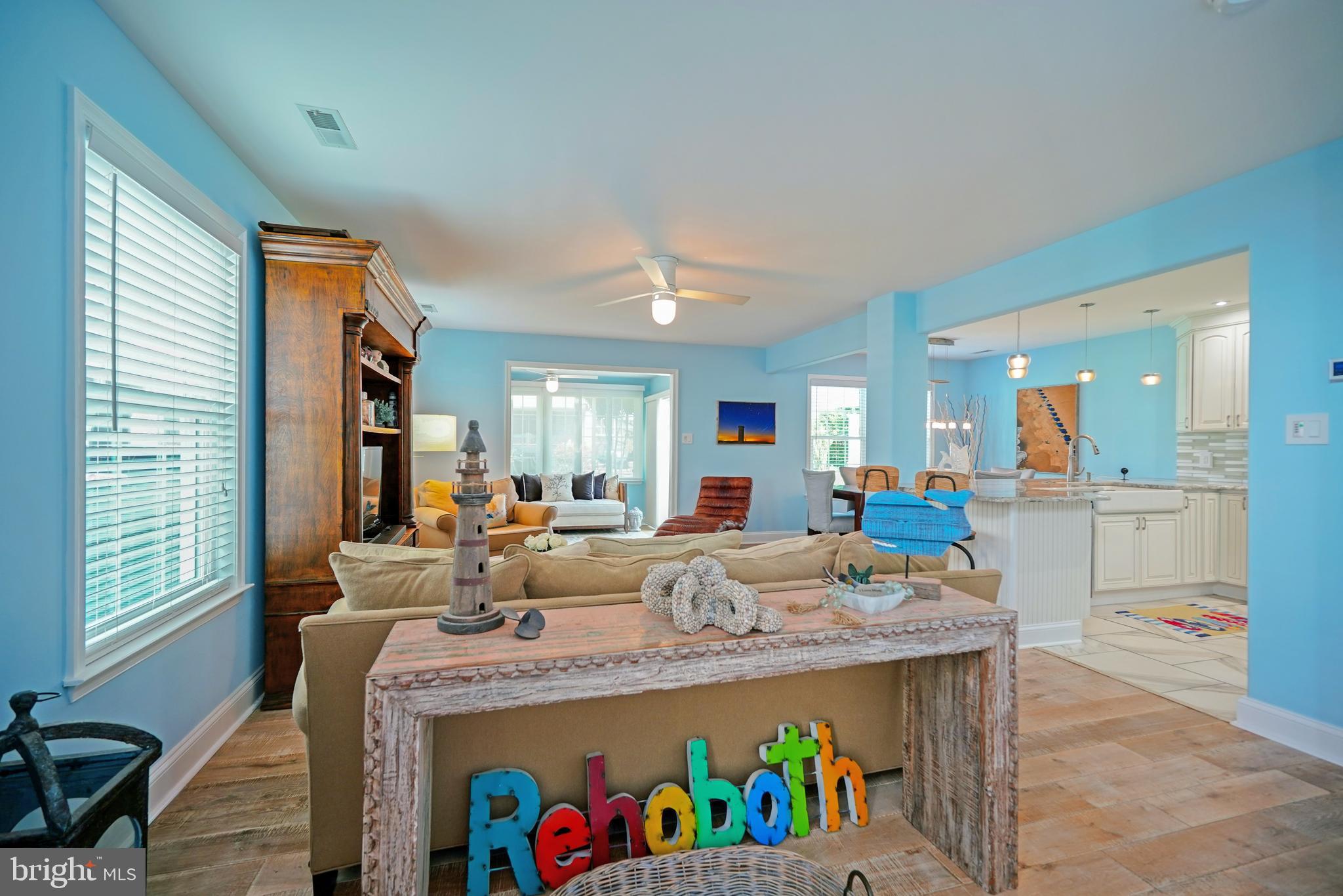 Villas at Eagles Landing Luxury Coastal Villa | 5 Bedrooms | 2.5 Baths | Welcome to one of the finest homes in Villas at Eagles Landing. Located in the highly sought-after Eagle’s Landing community in Rehoboth Beach, this meticulously maintained and beautifully upgraded five-bedroom, 2.5-bath villa offers a thoughtfully designed living space and the perfect blend of coastal luxury, comfort, and convenience. Residents enjoy access to three swimming pools, tennis courts, beautifully maintained grounds, and are just steps from local favorites including Big Fish Grill, Big Fish Seafood Market, Eden Restaurant, and Fractured Prune. Just a short drive or bike ride to Rehoboth Beach and the iconic boardwalk, this exceptional property is perfectly suited as a year-round residence, vacation getaway, or investment opportunity. With low HOA fees, a low-maintenance lifestyle, and rentals permitted, this home presents excellent income-producing potential in one of Delaware’s most desirable beach communities.
This stunning two-story residence has been completely remodeled with exceptional attention to detail and quality craftsmanship. The first floor features an open-concept design with gorgeous whitewashed engineered hardwood flooring throughout the main living areas. The beautifully renovated kitchen is a chef’s dream, showcasing stainless steel appliances, quartz countertops, solid wood pantry cabinetry, a spacious walk-in pantry, and elegant 24” x 24” tile flooring. A convenient half bath and laundry area complete the main level.  First floor primary suite on the main level, making it ideal for multigenerational living.
The bright, year-round sunroom is surrounded by expansive windows and sliding glass doors, filling the home with natural light while providing seamless access to the patio—perfect for summer grilling, entertaining, or simply relaxing. The thoughtful layout creates an easy flow for everyday living and effortless hosting.
A striking custom staircase with modern cable railing and a wood handrail creates a dramatic focal point upon entering the home. Upstairs, you’ll find a spacious suite with Trex deck, along with three additional guest bedrooms, offering plenty of room for family and visitors. Beautifully customized closets provide exceptional organization and storage throughout the home. The remodeled hall bathroom features elegant glass tile, marble flooring, and frameless glass shower doors, while every bathroom has been thoughtfully updated with premium finishes.
Additional improvements include all new Viwinco replacement windows, a Trane HVAC system installed in 2022, updated lighting, and high-end finishes throughout. The attached garage provides parking for one vehicle plus additional storage.
Every detail of this exceptional home has been carefully considered to offer both beauty and functionality. Homes with this level of renovation, spacious five-bedroom layout, and premier Eagle’s Landing location rarely become available. This is a rare opportunity to own a truly move-in-ready coastal retreat.
Whether you’re searching for a full-time residence, a luxurious beach retreat, or an outstanding investment property, this exceptional home delivers the very best of Delaware coastal living.