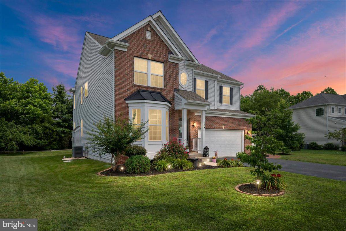 Welcome to 107 Brookfield Drive in the coveted North Brook community. Looking for a premium lot? Here it is!! No one behind you!!! You will not want to pass up these GORGEOUS views of nature !! This home boasts OVER 2600 sq ft of TRUE living space, NEW roof, upgraded flooring, and a stunning kitchen. As you walk up to this home, you will notice mature landscaping, gorgeous hard scapes and one of the best locations in North Brook. As you enter the home you will feel right at home. Open floor plan with refreshing neutral paint, gorgeous hardwood and tile floors are throughout the main level. To the left as you enter the home you have the front living room / office. This room is large, boasts high ceilings and large windows bringing in a ton of natural light!!! Down the hall you have the upgraded half bathroom with tile floors and upgraded vanity. Keep walking and the home opens up to the MASSIVE family room with gorgeous hardwood floors, gas fireplace, and a wall of windows overlooking your private yard. This is all open to the STUNNING kitchen with eat in table space. The kitchen offers white cabinets, upgraded hardware, granite countertops, SS appliances, double ovens, upgraded gas cooktop, HUGE pantry and large island. Moving upstairs this home offers you a RARE finished loft space, great for a play room, movie room, second living room, etc!!! This space is a BONUS offering so many possibilities. There are not too many homes with this as finished space!!! Down the hallway you will find 3 LARGE bedrooms, with ample closet space, a LARGE laundry room, hallway bathroom with tile floors and a shower/tub combo. Finishing off the upstairs is the the owner’s suite. It’s large with gorgeous views of your private backyard. The owner’s bathroom boasts a double vanity, stand up tile shower, soaking tub and a HUGE master closet!!! Moving all the way downstairs, you have a 4 ft, conditioned crawlspace. This space is perfect for storage!!! The attached 2 car garage is allows you to park your cars, toys, and also space for storage. Outback you have a large, gorgeous composite deck, private yard and space to enjoy your evenings. The home also boasts a brick walkway from the deck to the shed and then wraps all the way around to the driveway. This home has it ALL!!! You will NOT find another home like this one in North Brook. All you have to do here is MOVE RIGHT IN!!! The community offers a new playground, soccer field, pavilion, walking path, and ponds!!! So much to offer in North Brook!!! Conveniently located to all major routes, shopping, and restaurants. You can get to DC, Baltimore, Annapolis, Dover, the Beaches and Middletown with ease!!! *Home has 50 amp service for RV/Generator hookup.
