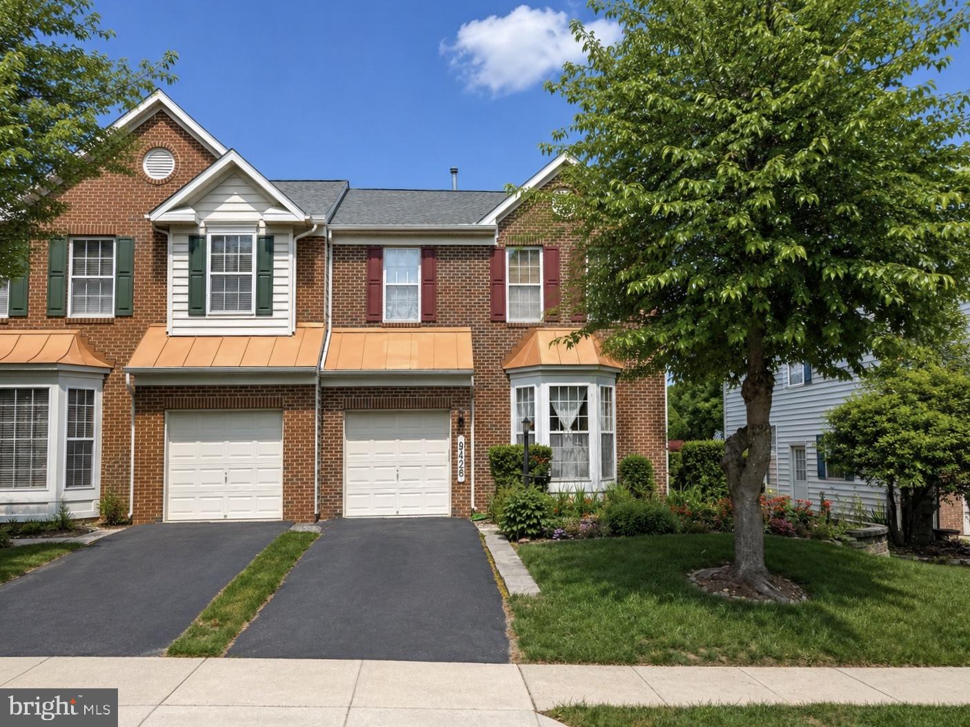 Move-in ready and exceptionally well maintained, this beautiful brick-front duplex in the highly desirable Westfields community offers over 2,500 finished square feet, thoughtful updates throughout, and a peaceful setting backing to open community green space. Mature landscaping, attractive curb appeal, and obvious pride of ownership are evident from the moment you arrive. Inside, freshly refinished hardwood floors extend through the kitchen, dining area, and morning room. The updated kitchen features quartz countertops, stainless steel appliances, gas cooking, a center island, breakfast bar, and plenty of cabinet and workspace. The adjoining morning room is filled with natural light and provides the perfect spot to enjoy your morning coffee or unwind at the end of the day. French doors lead directly to the rear patio, creating an easy connection between indoor and outdoor living while overlooking beautifully maintained common area beyond. Upstairs, the spacious primary suite features vaulted ceilings, a walk-in closet, and a private en suite bath with double sinks. Two additional bedrooms and a full hall bath complete the upper level. The finished lower level adds tremendous flexibility with a large recreation room, a true fourth bedroom with egress window, and a beautifully finished full bath highlighted by an oversized tiled shower. Major improvements include a 40-year architectural roof installed in 2024 with transferable warranty, updated HVAC, newer water heater, and numerous cosmetic improvements throughout. Residents of Westfields enjoy exceptional amenities including a resort-style outdoor pool, community center, tennis and basketball courts, playgrounds, walking trails, and beautifully maintained green spaces. Conveniently located just minutes from I-70, schools, shopping, dining, medical facilities, and everyday conveniences, this home offers the space, updates, outdoor setting, and community amenities that make it a place you'll truly look forward to coming home to each day.