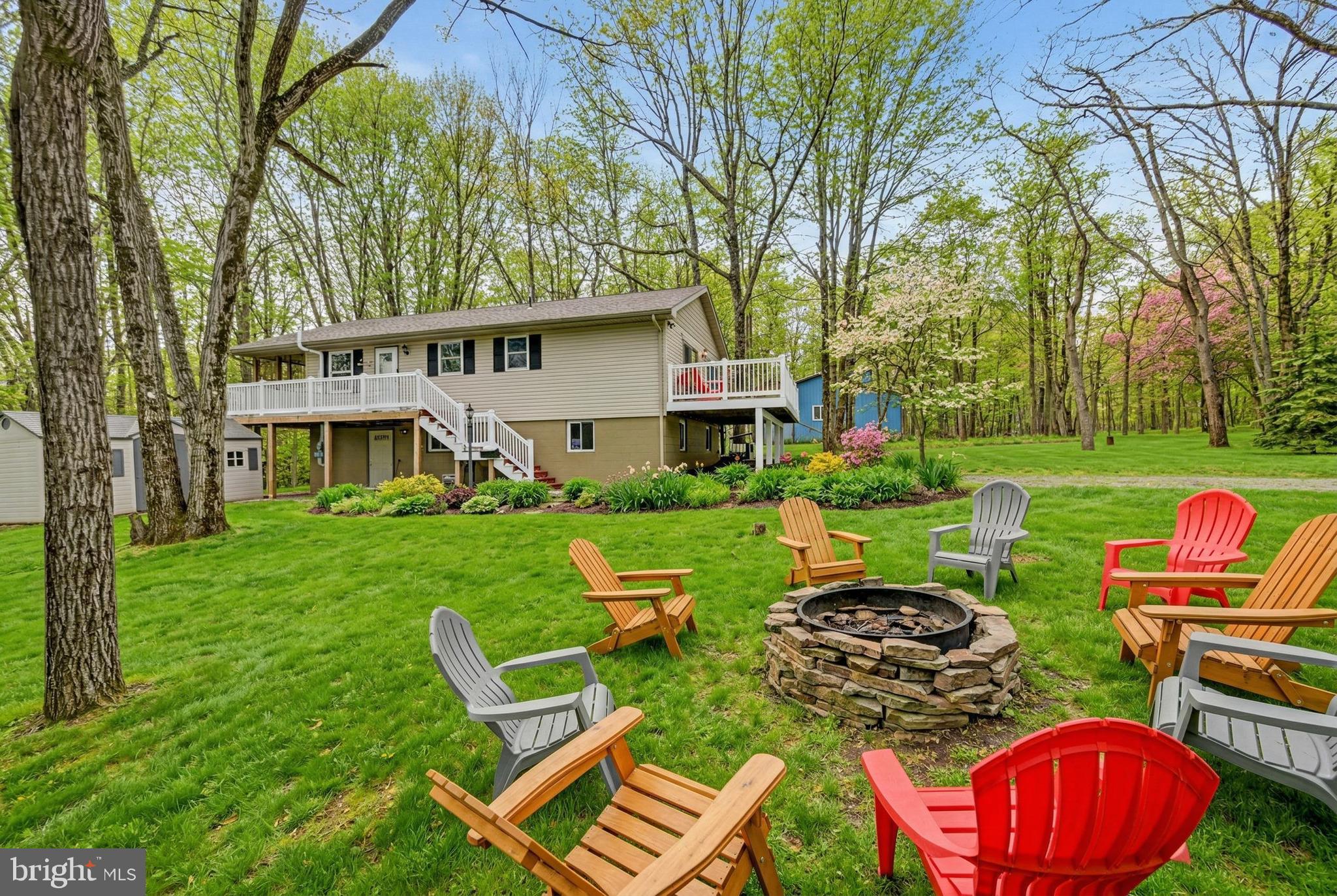 Plenty of fun here! Lovely home in Brier Crest Woods. Minutes from JFBB ski area, Hickory Run State Park, Jim Thorpe. Three Bedrooms on Main level, Cathedral Living Room/Kitchen with adjoining Screened in Deck. Enjoy the Natural Pocono terrain from your home with surrounding woods and serene setting. Lower level bar with kitchen, Family room Full bathroom and den with walk out slider to concrete patio. Circle Driveway with plenty of parking, firepit, storage shed. Walk, bike or golf cart to the private sandy beach and lake with swimming, boating and fishing. Furnished, Active Short Term Rental. Spring, Summer, Winter & Fall ''The Pocono Mountains 4 All Seasons''