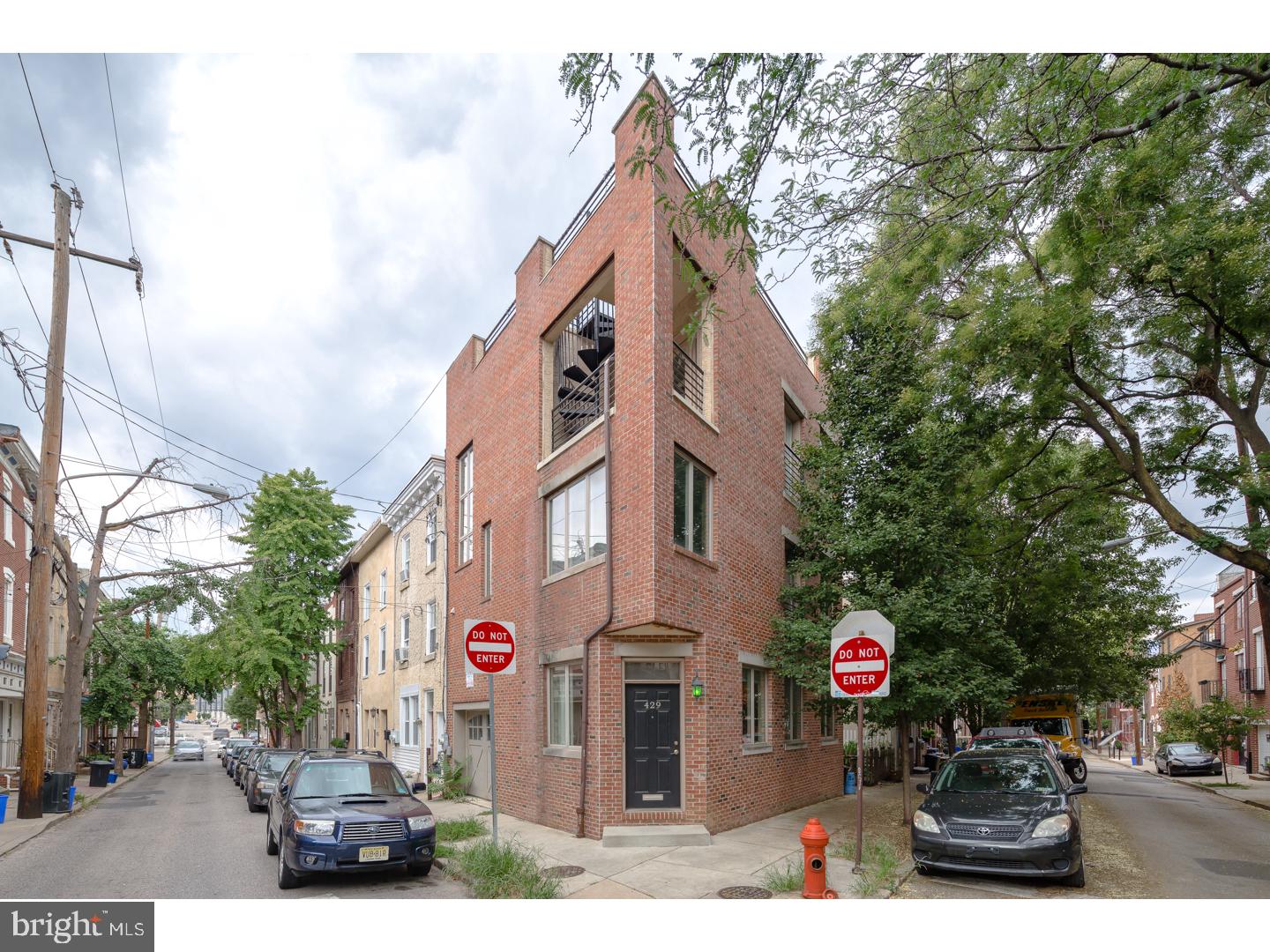 This beautiful 3 bedroom, 3-story with private 1 car garage, has a huge roof deck with panoramic views of Northern Liberties and Center City. Exquisite exterior corner facade with windows on 3 sides! Hardwood floors throughout, living room entrance, garage entrance. Lower level family room made for entertainment with plush wall to wall carpeting and a huge storage room under the garage. The kitchen has a breakfast nook with window views and access to slider doors overlooking the patio. Fully fitted kitchen with stainless steel appliances, granite counters, plenty of work space, and easy access to the patio for outdoor grilling. 2nd floor hall bath with marble tile, a beautiful wood vanity, and a large hall laundry room with side by side washer and dryer. The master bedroom suite is enchanting, filled with light, fitted walk-in closet, a private  bath, spa-inspired tile work with glass shower door. Access from the bedroom to a covered balcony and up to the roof top deck. Walking distance to dog park, Honey's Cafe, North 3rd bar, Standard Tap, Cafe La Maude and North Bowl. Easy to show, must see! We welcome your visit today.