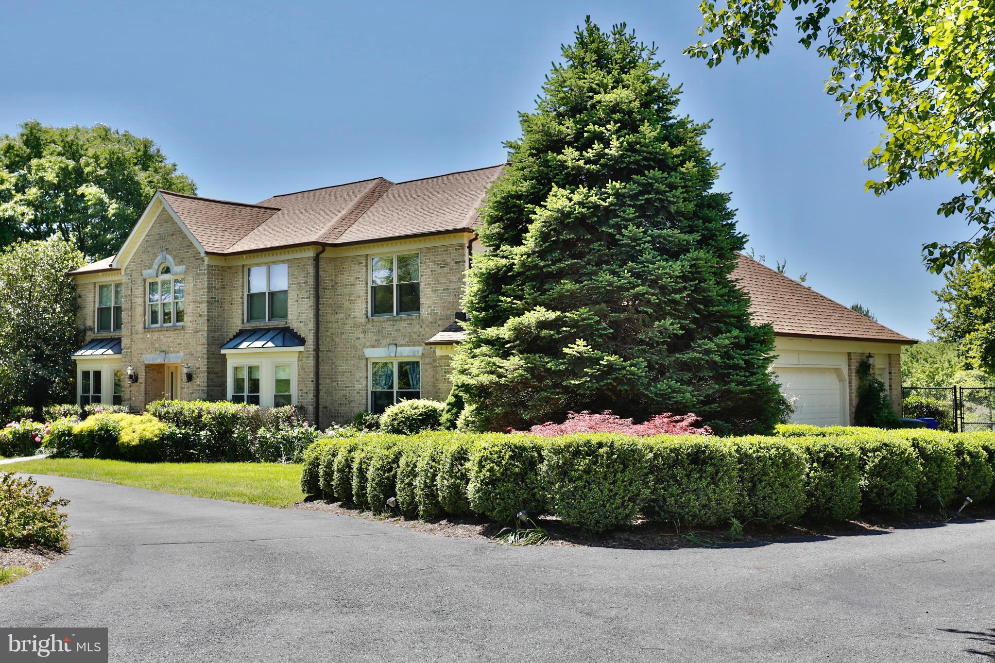 Huge home w/side-loading grg & circular driveway. Interior neutralized. 2-story foyer w/curved staircase; 2-story great rm w/3-side overlook & floor-to-ceiling masonry wall w/FP. Office on main. Fully-fenced back yard keeps deer away. Private 2.5-acre lot. Walk-out bsmt is a separate.apt w/full-size KT, BR, full BA, W/D. New in past 2 years: roof, siding, win's, doors. No HOA.