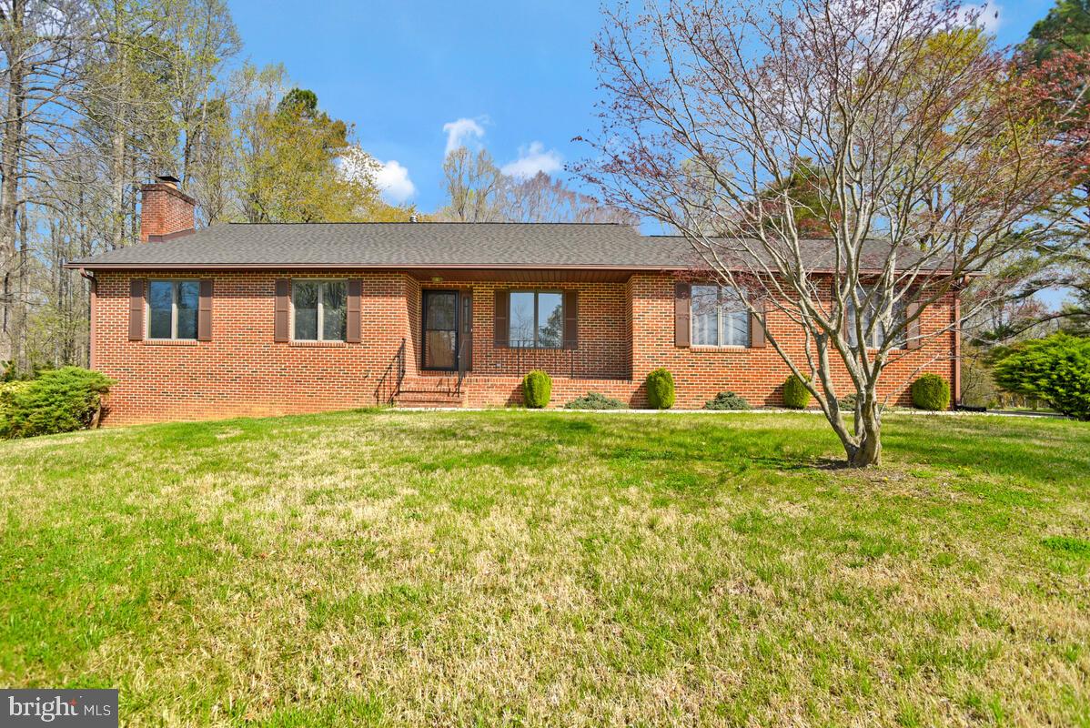 Welcome to this beautifully maintained all-brick rambler set on over 5 picturesque acres, offering space, versatility, and endless possibilities for country living.

This spacious home features 3 bedrooms and 3 full bathrooms, along with a thoughtfully designed layout that includes a large kitchen with an eat-in breakfast area and a separate formal dining room—perfect for both everyday living and entertaining. The inviting living room flows seamlessly into a bright four-season sunroom, creating the perfect space to relax and enjoy views of the surrounding property year-round.

The lower level offers additional flexibility with a second kitchen, full bathroom, and private entrance, currently set up as an efficiency-style living space—ideal for guests, extended household needs, or potential rental opportunities (buyer to verify use).

Step outside to enjoy a charming garden patio just off the lower level, providing a peaceful outdoor retreat. The property also includes an attached two-car garage, as well as a detached garage in the backyard that was previously used to house a helicopter and features a large concrete pad—perfect for hobbyists, storage, or workspace needs.

With over 5 acres of land, this property is well-suited for horses, livestock, or simply enjoying wide open space and privacy.

A rare opportunity to own a versatile property with unique features and room to grow!