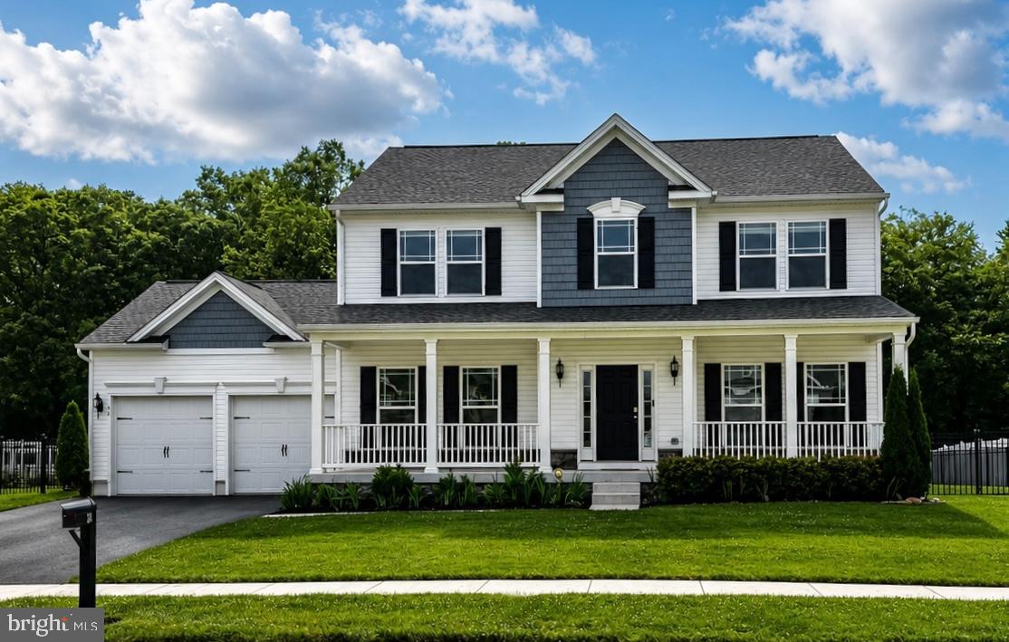 Welcome to 34 Pelham Drive, a beautifully maintained 4-bedroom, 2.5-bath home located in the desirable Pelham Place community. Offering a thoughtful layout and versatile living spaces, this residence is designed for both everyday comfort and effortless entertaining. Step inside to find a formal dining room to the left, ideal for hosting holiday gatherings and special occasions. To the right, a flexible front room provides the perfect setting for a formal sitting area, home office, or playroom. Continue through the home to the bright and inviting kitchen, featuring granite countertops, stainless steel appliances, a center island, pantry, generous cabinet storage, and ample workspace for meal preparation. The kitchen opens seamlessly to the spacious family room, where a gas fireplace serves as a warm focal point. Abundant windows fill the space with natural light, creating a welcoming atmosphere throughout. Sliding glass doors lead to the rear deck, offering the perfect extension of the living space for outdoor dining, relaxing, and entertaining. A convenient powder room completes the main level. Upstairs, the primary suite provides a peaceful retreat with a large walk-in closet and a private bath featuring a dual vanity, tub, and separate shower. Three additional  bedrooms share a well-appointed hall bathroom. The second-floor laundry room adds everyday convenience and functionality. The finished lower level expands the home's living space and offers endless possibilities, whether used as a media room, recreation area, fitness space, game room, or hobby retreat. Ideally situated near major commuting routes, shopping, dining, and everyday amenities, this exceptional home combines comfort, convenience, and a sought-after neighborhood setting. Schedule your private showing today!