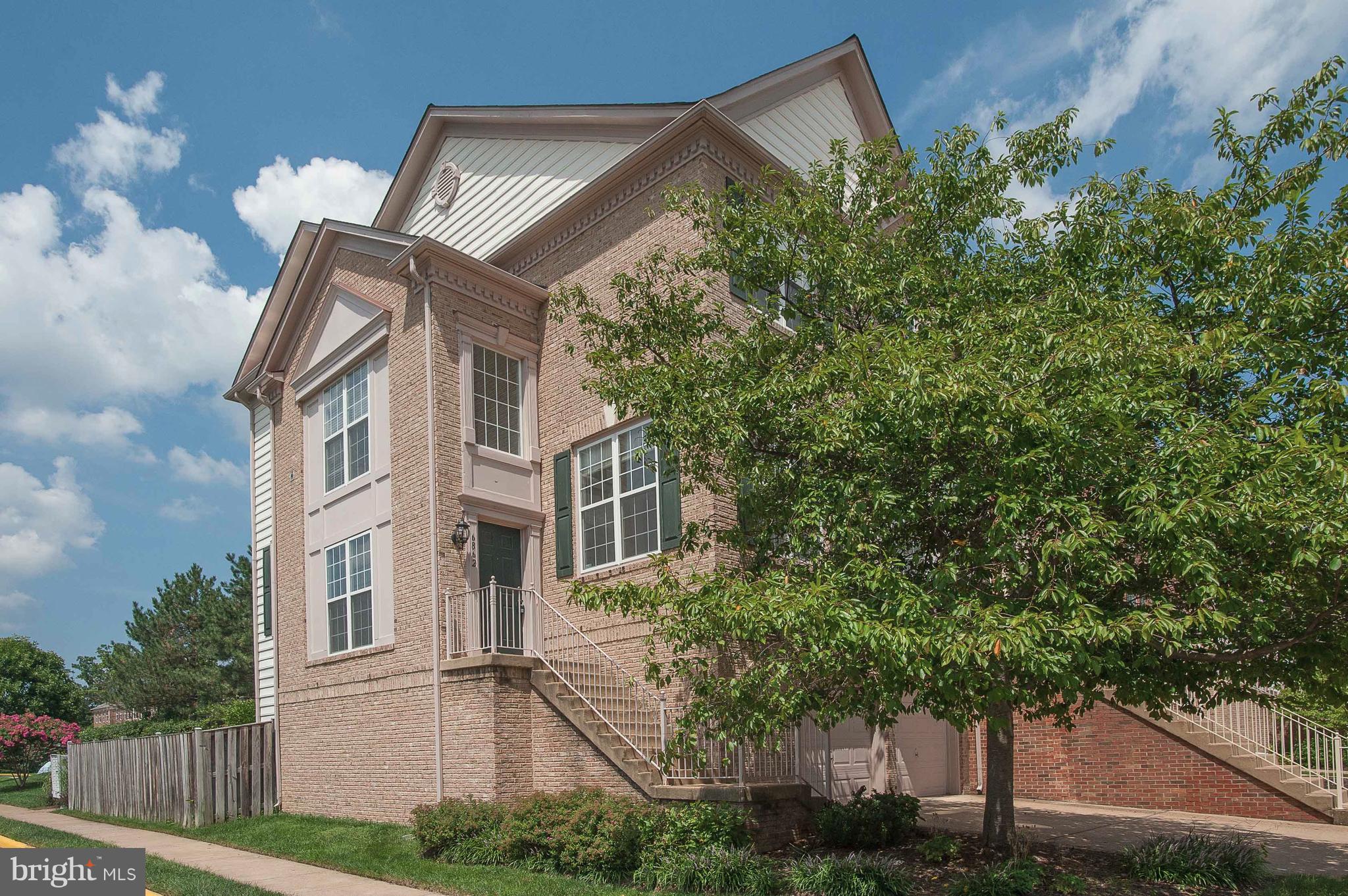 Welcome to 6862 Alicia Court, a simply gorgeous 2 sides brick, end-unit 2 car garage townhome backing to a treed common area in the popular Townes at Manchester Park community. It features 4 bedrooms, 3.5 baths and a flowing open floor plan. The spacious eat-in kitchen has newer 42-inch cabinets, granite counters, stainless appliances, recessed lighting, and a bay window in the breakfast area. Also on the main level are the family room with a cozy fireplace, great library and a bright living room that walks out to the large deck with stairs down to the fenced backyard with a custom patio and landscaping. You will love the owner's suite with its vaulted ceiling, walk-in closet and bath with separate shower and jetted soaking tub. There is a full bath, the fourth bedroom and a generously-sized rec room with a door out to the backyard on the lower level.  This home is in a prime location near Metro, Fort Belvoir and the Kingstowne Town Center with its shops and restaurants.  Community amenities include tennis courts, gazebo and a playground.