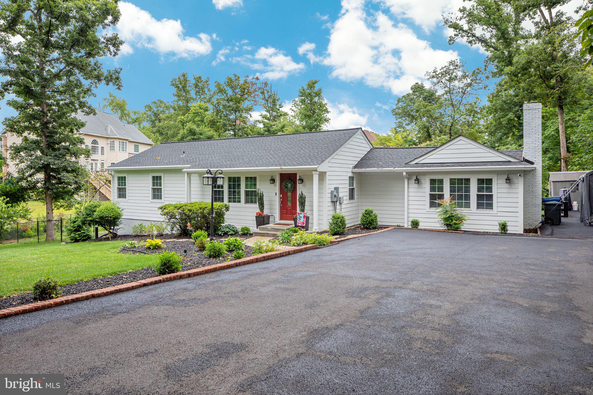 Welcome to this Woodley Hills gem! This home has been thoughtfully finished and immaculately maintained. This 4 bedroom/ 3 bath, 2500+ sq foot home sits on .56 acres of serene backdrop. A county park sits behind the home, offering a permanent wooded view. A perfectly landscaped front yard welcomes you, and the new driveway provides ample parking for friends. Nestled in historic Mt. Vernon, this picturesque home is minutes to George Washington's historic home, Fort Belvoir, Old Town Alexandria, DC, the Pentagon, and Fort Meade. You enter the sprawling renovated rambler to an open galley kitchen, breakfast nook, and two living spaces. An office with a view of the backyard is perfect for the work-from-home porfessional. The fireplace was recently updated with ceramic logs and a dedicated gas line with a full tank - ready for a chilly winter. The updated deck, just off the breakfast nook, is the perfect spot to take your morning coffee while watching the dogs (or kiddos!) play in the fenced backyard. Beyond the fence is more green space, with a creek bed that allows for proper drainage for your lawn. This home boasts 3 bedrooms and 2 full baths on the main floor, replete with high end finishes and refinished hardwood floors. The primary en-suite is nestled in the rear of the home and boasts a large walk in closet and views of the backyard. The walkout basement features another living room, bedroom, and updated full bath, as well as an unfinished storage area or workshop. This home has it all - a quintessential Alexandria neighborhood, a rich history, modern updates to suit modern buyers, all within minutes of DC metro's best.
** This home has a current lease in place until November 2024**