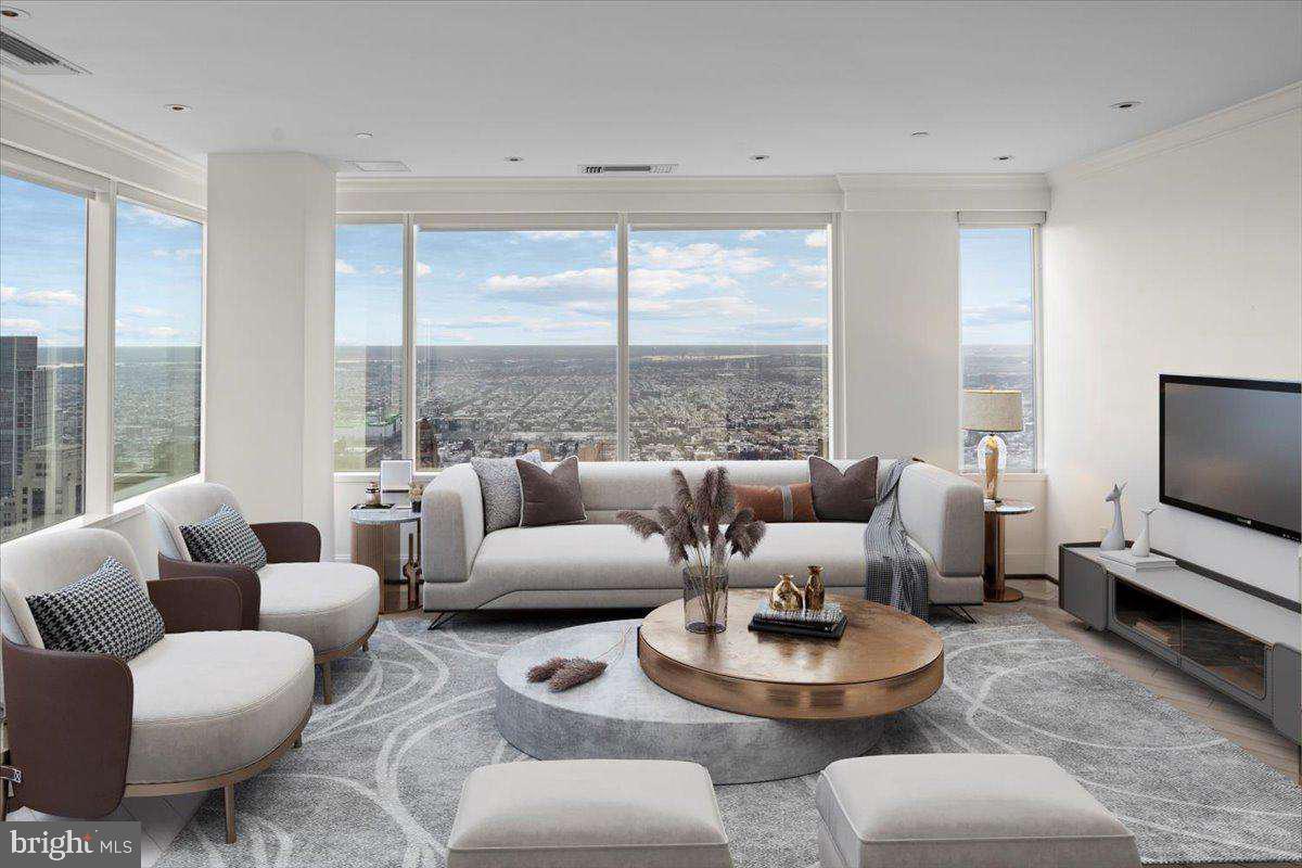 Sweeping 270º unobstructed view from this corner unit at The Residences at Two Liberty Place - the best in the building. This recently remodeled, exquisite unit features a fantastic gourmet kitchen with every upgrade imaginable, the best appliances, tremendous living room and dining room with windows surrounding both rooms, upgraded mahogany diagonal flooring throughout the living room, kitchen/dining area, hallways, and den/third bedroom, custom lighting, electric remote control sun shades on the windows, very large master suite with private bath and huge walk in closet, 2nd large bedroom & an additional room that could be used as an office, den, or third bedroom. 40th Floor location means best Wi-Fi signal, phone connection, and water pressure in the building. Express elevator to the 40th Floor means no waiting.
The Residences at Two Liberty Place offers 5-star hotel amenities including private chauffeured driven Cadillac Escalade car service, 24-hour doorman, 24/7 concierge, valet parking, a newly-redesigned Owner's Club/lounge/media room, Fitness Center with Yoga Studio, Endless Pool, Personal Trainers, and massages.