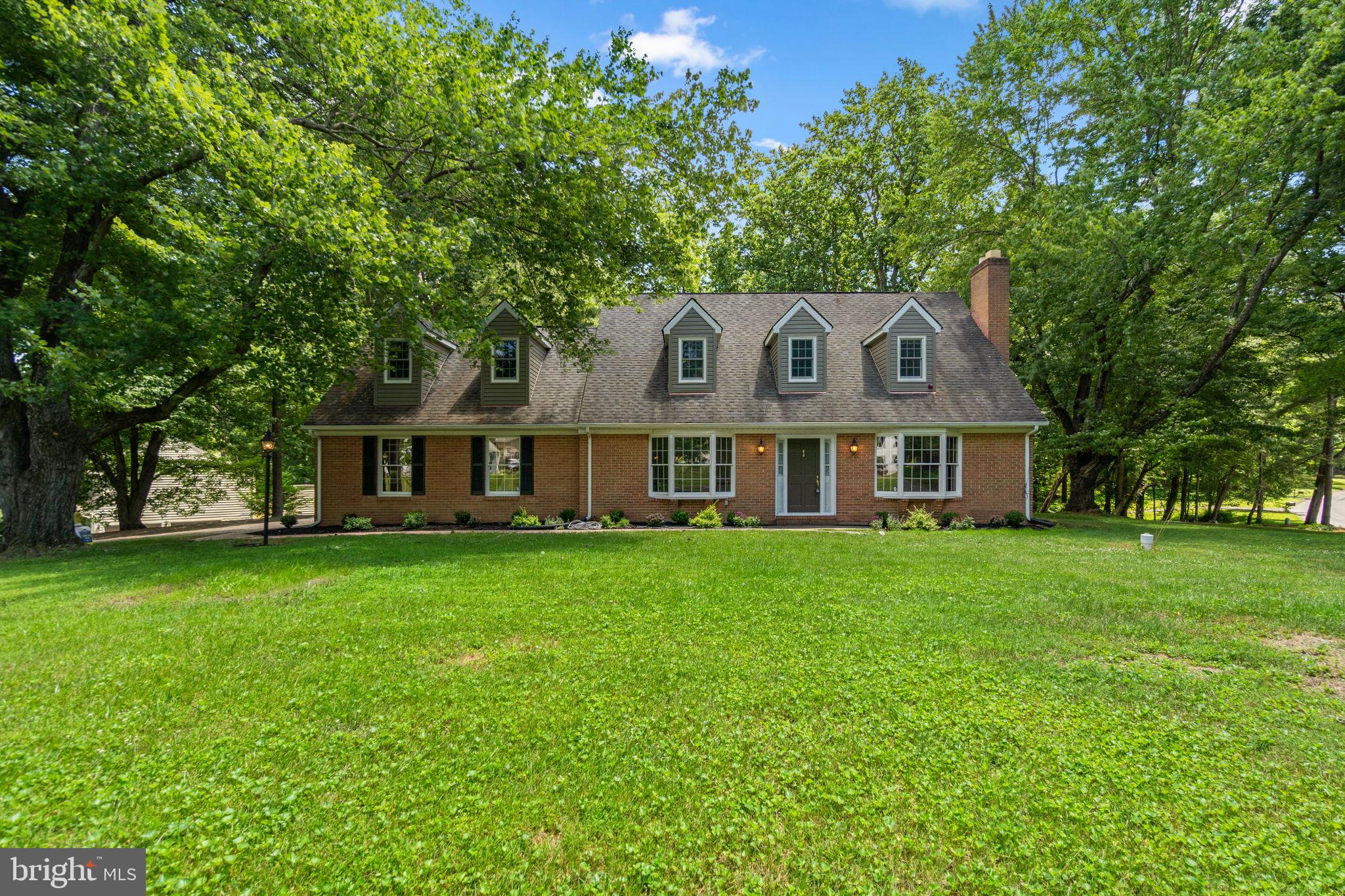 Marriotts Ridge High School | Exceptional Corner Lot | Move-in Ready | Welcome to 10054 Green Clover Drive, a beautifully maintained brick home situated on a desirable corner lot in the sought-after Allenford community of Ellicott City. Set on a spacious, level lot with diverse landscaping and exceptional curb appeal, this property is move-in ready from day one and offers a significant amount of high-demand features. A large asphalt driveway provides abundant parking and leads to a side-entry garage with an additional storage bump-out, offering plenty of space for vehicles, hobbies, and everyday storage needs. The expansive yard provides endless possibilities for outdoor enjoyment, from play space and entertaining to the potential for a future pool or sports court. A rear patio and deck create the ideal setting for relaxing or gathering with family and friends. Inside, you'll find a move-in ready home that has been thoughtfully prepared for its next owner. Recent improvements include fresh paint (2026), new carpeting (2026), professional cleaning (2026), and updated landscaping (2026), allowing you to settle in and enjoy the home from day one. Warm wood flooring, charming architectural details, and four bedrooms w/ three full bathrooms add character and convenience throughout. The kitchen was tastefully updated and offers quality cabinetry, generous workspace, and timeless finishes that continue to serve as the heart of the home. The home's flexible layout provides comfortable living spaces for everyday life while offering room to grow. The unfinished lower level spans more than 1,100 square feet and has been freshly cleaned and painted (2026), presenting an incredible opportunity to create additional living space tailored to your needs. Whether you envision a home gym, recreation room, workshop, play area, or future finished basement, the possibilities are abundant. Allenford remains one of the most desirable communities in the greater Ellicott City area, known for its spacious homesites, distinctive architecture, mature landscaping, and exceptional convenience to shopping, dining, commuter routes, and everyday amenities. Adding to its appeal, this home is currently served by highly regarded Howard County schools, including nationally recognized Marriotts Ridge High School. Offering space, charm, and an outstanding location, 10054 Green Clover Drive is a wonderful opportunity to enjoy one of Howard County's most established and sought-after neighborhoods.