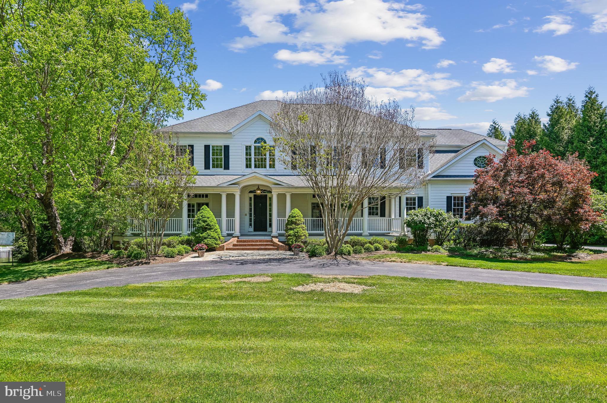 **Stunning Southern Colonial in Braeside: Your Dream Home Awaits!**

Welcome to the desirable enclave of Braeside, where this 5-bedroom, 4 full and 2 half-bathroom Southern Colonial residence invites you to experience “the good life” living on a beautifully landscaped 1.4 acres. Nestled within a charming 15-home community, this property boasts an inviting wrap-around porch, setting the stage for warmth and hospitality.

The moment you step through the entryway you will be greeted by a sense of home. The main floor features beautiful hardwood flooring, soaring high ceilings, and spacious rooms bathed in natural light. The living room and formal dining room flank a grand 2-story foyer, perfect for both entertaining and everyday living. A butler’s pantry, equipped with a wet bar and wine fridge, seamlessly connect the dining room to the expansive chef’s kitchen. Here, culinary enthusiasts will delight in the oversized island, top-of-the-line appliances, quartz countertops, a second beverage fridge, an impressive custom range and hood, 2 wall ovens, a heavy-duty hidden mixer lift, and abundant custom cabinetry that provides storage galore.

Prepare to be wowed as you enter the two-story family/great room, featuring stunning custom woodworking, magnificent floor-to-ceiling windows, and a stately wood-burning fireplace that serves as a striking focal point, complemented by built-in window seats perfect for adding more people to casual or important conversations. Rounding out the main level, you’ll find a generously sized private office, two convenient half-baths, and a spacious utility/laundry room complete with a second refrigerator and additional storage.

Venture upstairs via your choice of the grand staircase or the rear stairs leading from the kitchen. The expansive primary suite promises relaxation, boasting a cozy sitting area with gas fireplace and there are dual walk-in closets. The en-suite bathroom features a double vanity, a luxurious soaking tub, and a dedicated shower for a serene retreat. On the other side of the 2nd floor, bedroom 2 offers its own private en-suite bathroom, while bedrooms 3 and 4 share a thoughtfully designed en-suite bathroom, providing comfort and privacy for family and guests alike.

The lower level enhances the home's versatility with a spacious recreation room, a dedicated home gym, a fifth bedroom, a full bathroom, and an oversized utility storage room, including a wine storage closet for the connoisseurs at heart. A three-car attached garage ensures ample space for protecting vehicles and gear.

Now, let’s talk about entertaining! Step outside to the expansive covered rear veranda, perfect for alfresco dining, lounging, sipping, lallygagging or simply soaking in the beauty of your surroundings. The heated pool serves as the centerpiece for summer gatherings, where friends and family can create memories that last a lifetime.

All of this is conveniently located just far enough from the hustle and bustle while being mere moments away from grocery stores, wine shops, charming cafes, delightful restaurants, coffee shops, and more. Experience the perfect blend of tranquility and accessibility.

Welcome home—where your dream lifestyle awaits! Reach out today to schedule your private tour!
