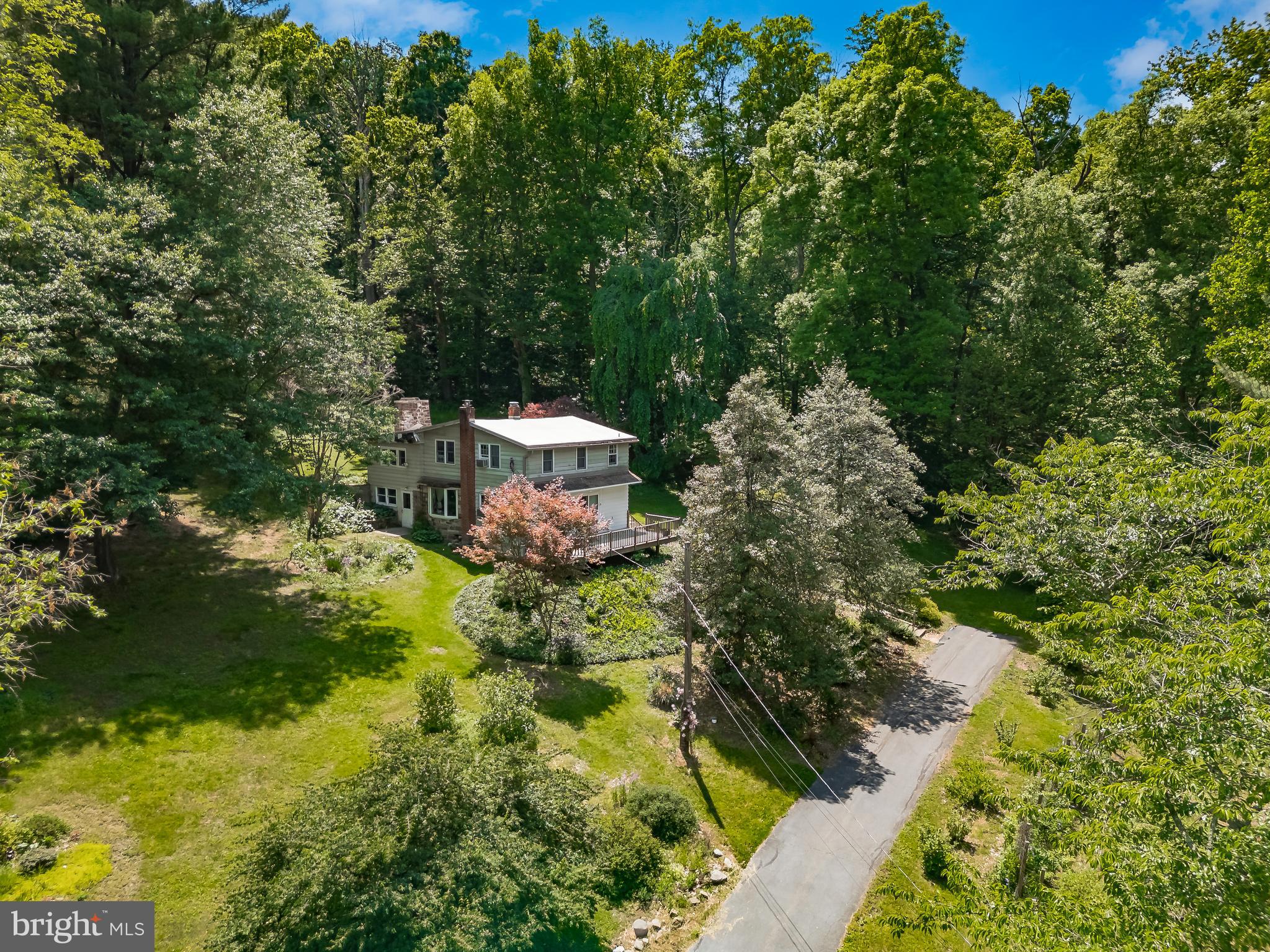 5.2 Acres of Privacy, Character & Creative Possibility in Owen J. Roberts Schools

Set on a 5.2-acre wooded property in Chester County within the sought-after Owen J. Roberts School District, this distinctive split-level home offers a rare combination of privacy, warmth, and flexible living spaces.

Tucked into a peaceful natural setting, the home welcomes you with wood flooring, abundant natural light, custom built-ins, and thoughtfully designed spaces that feel both inviting and full of character. The main level offers comfortable everyday living with a spacious eat-in kitchen, separate dining area, and gathering spaces that connect naturally to the surrounding landscape.

Thoughtful built-ins and handcrafted details throughout the home add warmth, functionality, and a sense of craftsmanship.

One of the standout features is the dedicated studio / creative flex space—ideal for artists, makers, remote work, hobbies, ceramics, woodworking, or additional flex space. Whether envisioned as a private retreat, gallery-inspired workspace, creative studio, or quiet escape, this area offers remarkable flexibility and opportunity.

Upstairs, generously sized bedrooms provide comfort and adaptability for changing needs and lifestyles, with spaces that work equally well for guests, home office use, or quiet retreat areas.

Step outside to experience the true highlight of the property—expansive acreage, mature trees, and a peaceful setting that feels like your own private escape. A raised deck overlooking the landscape provides the perfect place to relax, entertain, or simply enjoy the view.

Property is being sold as-is. Inspections are welcome, presenting an exceptional opportunity for buyers seeking acreage, character, and the ability to make a unique home their own.

A rare opportunity to own a private Chester County retreat with room to create, gather, and grow.