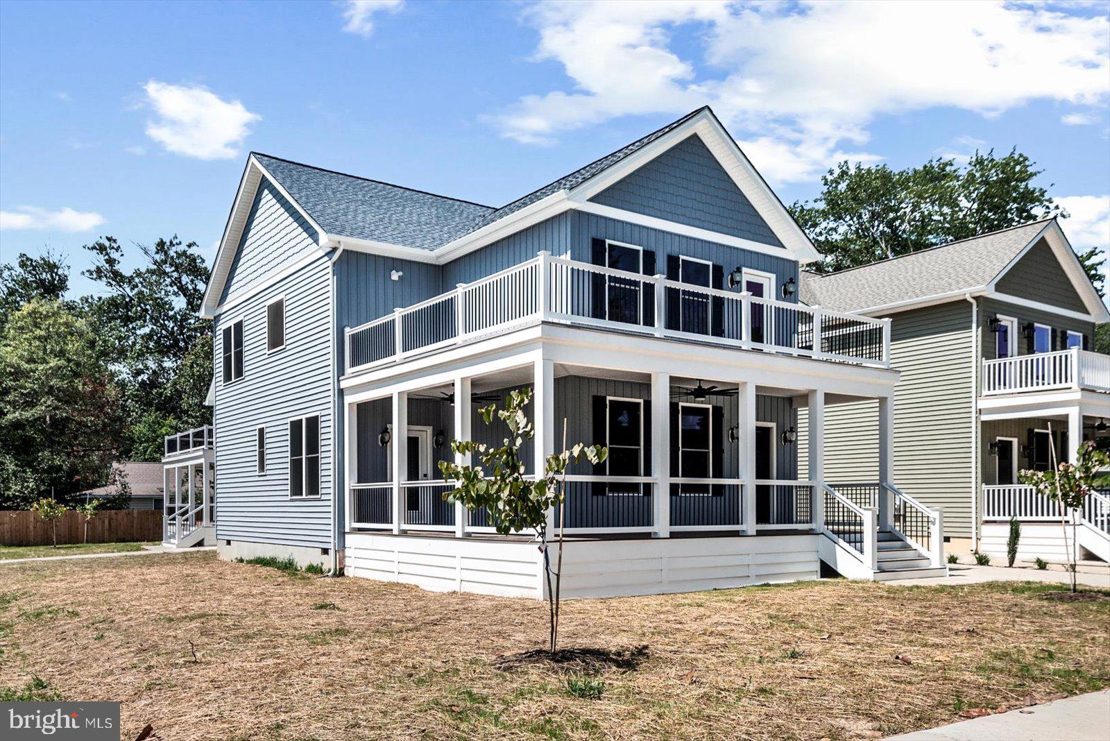 Imagine starting the day on a wraparound porch and ending it with a walk along the Potomac River just a few blocks away.

There’s something special about a house with a big wraparound front porch—it invites you to slow down, sit for a while, and enjoy the neighborhood. This beautiful new construction home sits on a corner lot just a few blocks from the river, perfectly positioned to enjoy everything Colonial Beach has to offer.

Inside, the main level feels open, comfortable, and easy to live in. The kitchen sits at the center of it all, featuring a large island for gathering, a walk-in pantry, and a layout that flows naturally into the living and dining spaces—perfect for everyday life or hosting friends after a day at the beach. A main-level bedroom or flex space adds versatility, and the screened-in back porch is the kind of space you'll find yourself using all the time.

Upstairs, the primary suite feels like its own private retreat, complete with a wraparound balcony—a perfect spot to catch the breeze or start the day with coffee. The suite also includes a spacious walk-in closet and a beautifully finished en suite bath with a soaking tub and walk-in shower. Two additional bedrooms, a full bath, and upstairs laundry connections round out the second floor.

With multiple porches, generous living spaces, and the river just down the street, this home offers the relaxed coastal lifestyle people love about Colonial Beach—whether you're here full time or escaping for the weekend.