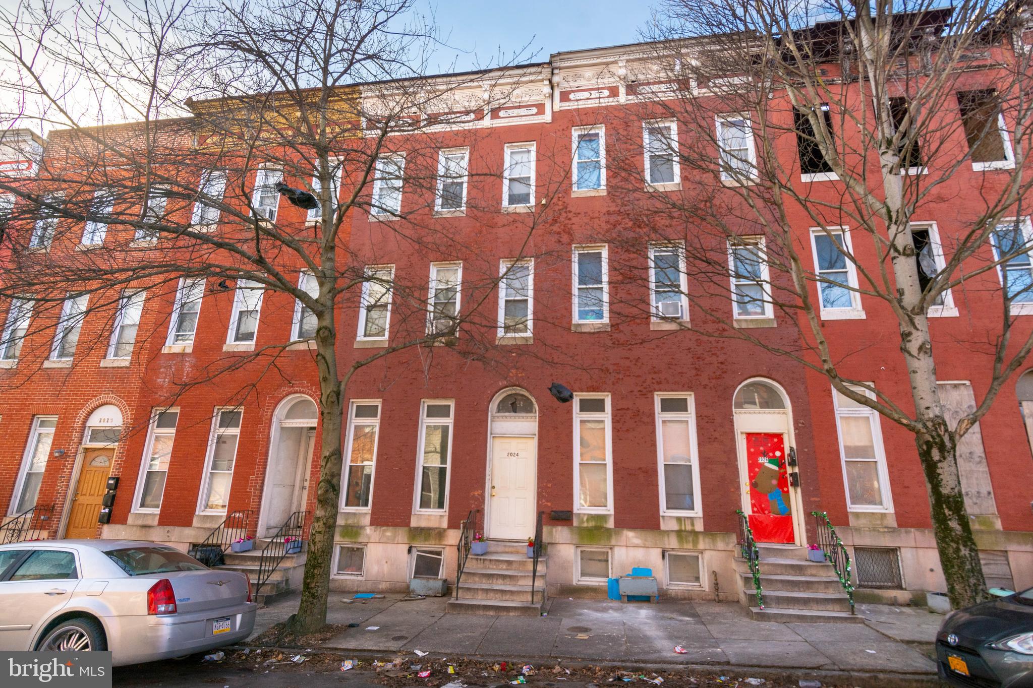 INCREDIBLE INVESTMENT OPPORTUNITY! LARGE 3 LEVEL ROWHOME THAT HAS BEEN USED AS A ROOMING HOUSE BRINGING IN $3,900/MO IN INCOME! Main level has 2 bedrooms, 1 full bath, and a kitchen. 2nd level also has 2 bedrooms, 1 full bath, and a kitchen. 3rd level has 3 additional bedrooms and the basement is partially finished with an additional bedroom. Monthly expenses are approximately $750-$800/mo. Property needs work but is perfect for the savvy investor! Sold As-Is!