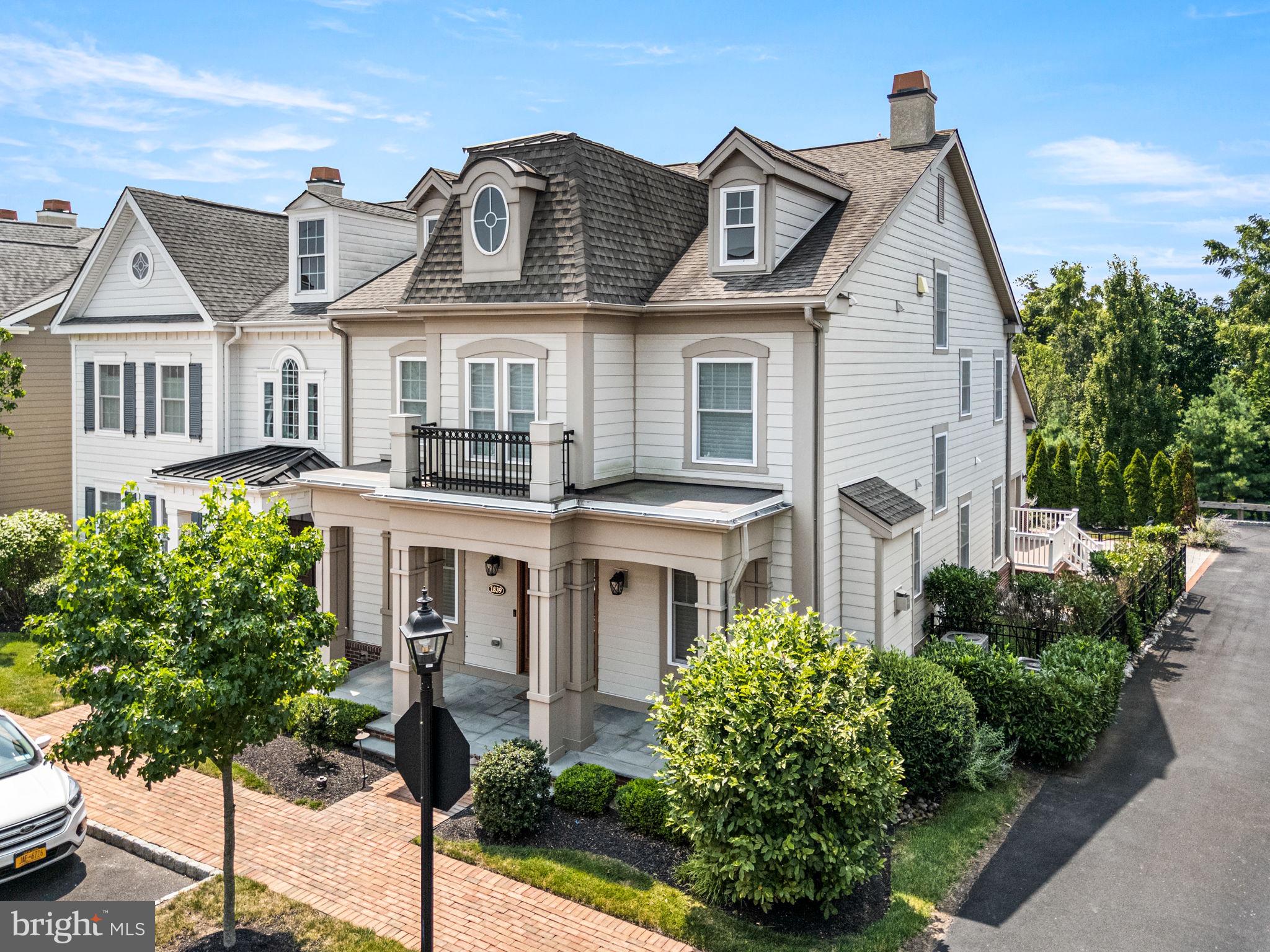 Welcome to  this remarkable, move in ready home at 1839 Windflower Lane- An Exceptional Luxury Retreat in Yardley’s Most Sought-After Enclave. Nestled in the heart of prestigious Yardley, this exquisite home at 1839 Windflower Lane blends timeless sophistication with refined modern living. Set on a beautifully manicured lot in a quiet, tree-lined neighborhood, this residence offers unmatched elegance and attention to detail. From the moment you arrive, you are greeted by impeccable curb appeal—lush landscaping, a stately HardiPlank façade, and an inviting covered entryway that sets the tone for what lies within. Inside, soaring ceilings, rich hardwood floors, custom millwork, and designer lighting create a striking first impression. The heart of the home is a gourmet chef’s kitchen, appointed with top-of-the-line Sub Zero, Viking & Wolf appliances, quartz countertops, custom cabinetry, and two oversized islands perfect for entertaining. Just off the kitchen is the butler’s pantry, with tons of cabinet space for more storage and a sink. Seamlessly connected to the dining area and expansive family room with a coffered, this open-concept space is ideal for everyday luxury living and elegant hosting alike. Down the hall are two more generously sized coat closets, access to the oversized two car garage, and sliding glass doors leading out to your Trex Deck. Retreat to the lavish primary suite on the second floor, a serene sanctuary featuring tray ceilings, a spacious sitting area, walk-in closet with custom organization, and a spa-inspired en suite bath with a soaking tub, oversized glass shower, and dual vanities. Two additional bedrooms on this level are equally well-appointed, offering ample space and comfort for family or guests. One of the additional bedrooms has an en suite full bathroom, and a nicely sized walk in closet with custom organization. The main laundry room is on this floor for optimum convenience, featuring top of the line GE front loader washer and dryer. On the third floor, you will find the 4th bedroom with a huge walk in closet with custom organization, along with a full bathroom. This bedroom could be used as a loft space, gym, playroom, mancave- the possibilities are endless. The finished lower level provides even more living space, equipped with a kitchenette and huge walk-in closet, which would be ideal for an in-law suite, home theater, fitness center, or game room. There are 2 additional closets, an unfinished area, and a second set of washer & dryer that makes up the rest of the lower level. Additional highlights include smart home upgrades, and access to top-rated Pennsbury School District. Ideally located just minutes from historic Yardley Borough, fine dining, shopping, and major commuter routes, this home offers the perfect blend of luxury and convenience. 1839 Windflower Lane is not just a home — it's a lifestyle. Schedule your private showing today and experience the unparalleled quality and elegance this remarkable property has to offer.