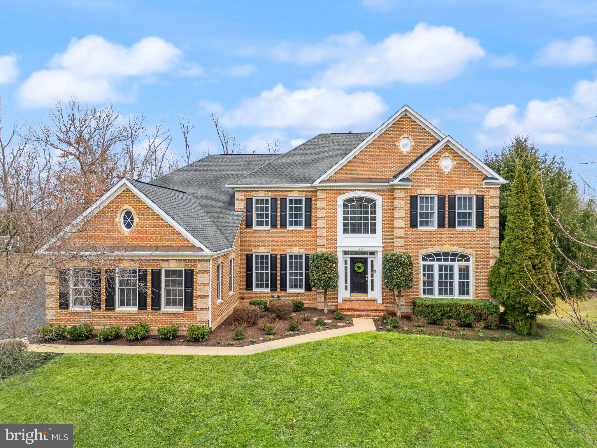 Welcome to this stunning brick-front estate home located in the prestigious gated, golf-course community of Piedmont.  Perfectly nestled on a quiet pipestem lot offering privacy and space on 1.23 acres and spanning over 6,100 square feet, this beautifully designed home is crafted for family comfort, entertaining and everyday convenience. This 5 BR/4.5BA, 3 car side-load garage home offers multiple use rooms and flex spaces for your large or extended family. From the moment you step inside, you'll love the soaring 2 story foyer and grand staircase creating an inviting, open feel. The gourmet eat-it kitchen features a large island, hardwood floors, granite countertops, stainless steel appliances, loads of cabinets and a spacious layout that seamlessly connects to the bright breakfast room, perfect for sipping your morning coffee while watching the kids play in the backyard! The sunken great room offers a cozy retreat, complete with a gas fireplace and Palladian window that is ideal for gathering around with loved ones. The dedicated home office with built-in workstations is perfect for working from home or homework time. The dining room offers a  large enough space for family gatherings and is conveniently located off the kitchen. The oversized,  primary suite is a true sanctuary—featuring a tray ceiling, sitting area, 2 walk in closets, a laundry chute, dressing room, an updated spa-like ensuite with dual sinks, tub, frameless glass shower doors w/ steam shower system, modern LED mirrors  and stylish fixtures.  Four additional bedrooms provide ample room for a growing family and two additional full bathrooms, one ensuite as well as a Jack and Jill bathroom. The finished walk out basement is an entertainer’s dream—complete with an au pair/in-law suite with full bathroom, bar area, rec. room, family room , exercise room and multiple storage areas making it perfect for guests or multi-generational living. Step outside to your lush and beautifully landscaped yard that features a 13 zone in-ground sprinkler system.  Enjoy the 2,000 sq. ft. multi level deck, 2,200 sq. ft. patio perfect for watching the kids play or enjoy a game of H-O-R-S-E on the basketball court in the side yard. Lots of storage located under the deck to hide the backyard necessities as well. Recent updates include new carpets (2025), new washer (2024) , new dryer (2023), new asphalt driveway (2024), updated primary ensuite (2025) , fresh paint (2025) and new windows and back door in kitchen (2022). Piedmont offers 24/7 monitored gated security, 2 Outdoor pools, 1 Indoor pool, Fitness Center, Lighted Pickleball and Tennis courts, Tot Lots, Walking/Jogging Paths, Basketball Court and the 18-hole Tom Fazio designed Championship Golf Course (social and golf memberships available) . Located within minutes of shopping, restaurants, wineries, parks, I 66, 29, 15, commuter lots and top-rated schools —your dream home is waiting!