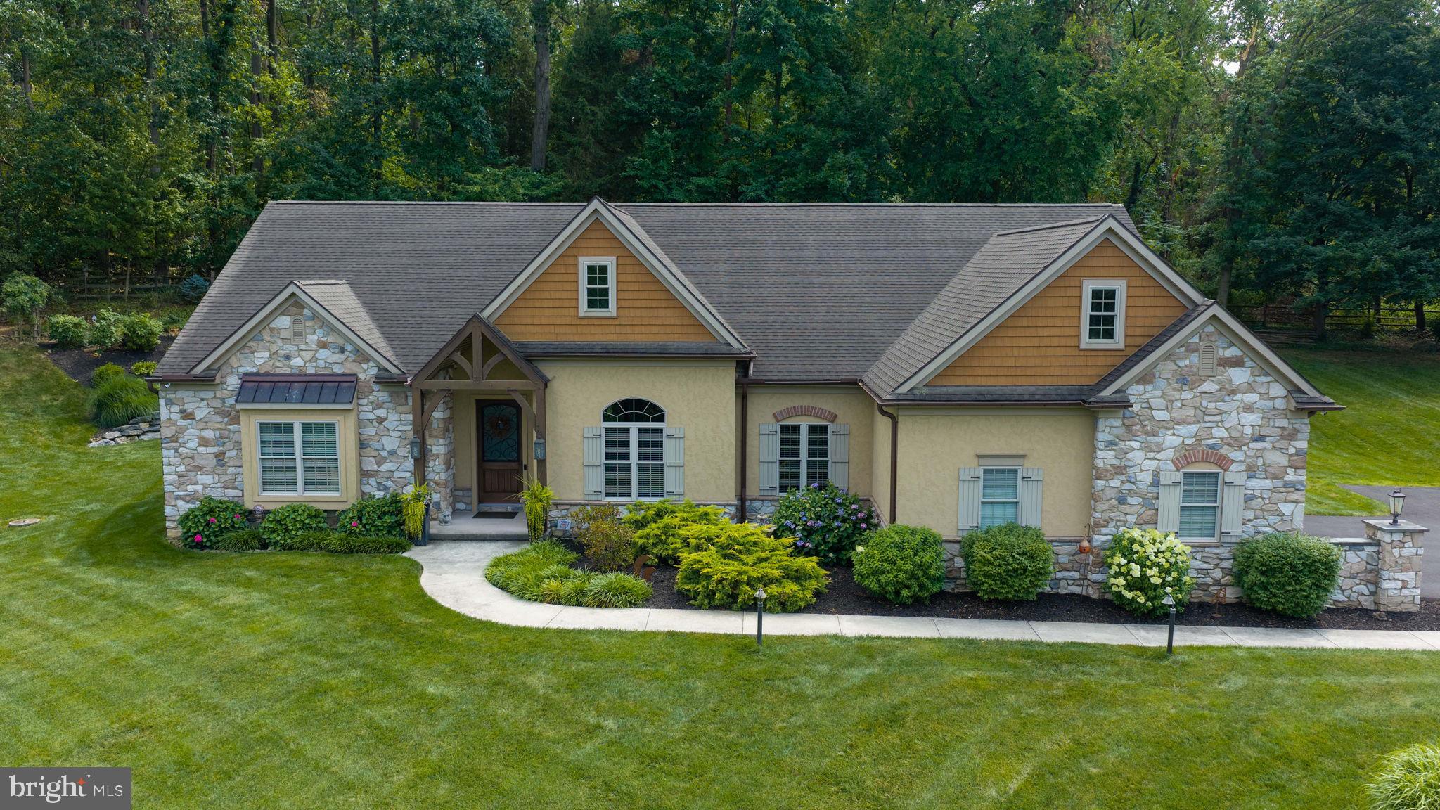 OPEN HOUSE August 1 SATURDAY 1:00-2:30*Nestled on a private 2.4-acre lot in the heart of Manheim Township, this stunning custom-built 4-bedroom retreat offers tranquility and adjoins 70 acre Landis Woods*Old World architectural details, fine craftsmanship,10-foot ceilings, hardwood floors, trim and crown moldings, abundance of natural light, in open living spaces*The first floor boasts a gourmet kitchen with top-of-the-line appliances, tile backsplash, granite countertops, large center island/breakfast bar for culinary creations, a hidden walk-in pantry and a dining area* Kitchen and Formal Dining Room overlooks spacious family room with a cozy gas fireplace.*A formal dining room is perfect for large gatherings*A professional home office or study* A mudroom with ample built-in storage ensures a clutter-free entryway from the garage* Large pane windows in the kitchen's dining area, screened porch and patio enjoy the panoramic views of the rear yard and neighboring woods*The primary owner's retreat with two large walk-in closets and a new luxuriously appointed full bathroom. features large walk-in tiled shower, heated floor*The unfinished basement offers exercise area, ample storage space and includes an outside entrance and rough-ins for future finishing*Additional features include a finished second-floor bedroom or office/2nd family room with a private half bathroom, a spacious oversized attached 2-car garage, radiant floor heating in the family room and kitchen, and a detached 25' x 32' insulated garage building with electricity*Conveniently located near top-rated Manheim Township schools, a pristine 70-acre natural preserved municipal park, healthcare facilities, shopping centers, Downtown Lancaster, and major highways*.