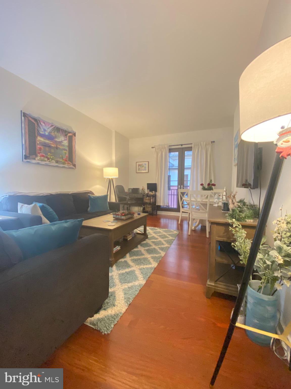 Generously sized one bedroom plus den/office with a Juliet balcony at Parc Rittenhouse on Rittenhouse Square! Enter the home through a large foyer that leads into the living/dining room. The home features Brazilian cherry hardwood floors throughout and a separate kitchen showcasing contemporary cabinetry that has brushed stainless steel bar pulls, granite countertops, stainless steel GE appliances and a LG washer/dryer. The full hall bathroom is appointed in marble with a contemporary vanity with marble countertop and a shower/tub. Residents of Parc Rittenhouse enjoy world class amenities and services including a 24 hour doorman; an amenities suite that includes a brand new state-of-the-art fitness center and resident lounge with pantry; media room; outdoor rooftop pool club with a large pool deck, full size pool, kids pool and hot tub; garage parking below the building for an additional fee; and two amazing restaurants on the ground floor, Stephen Starr’s Parc and Via Locusta.