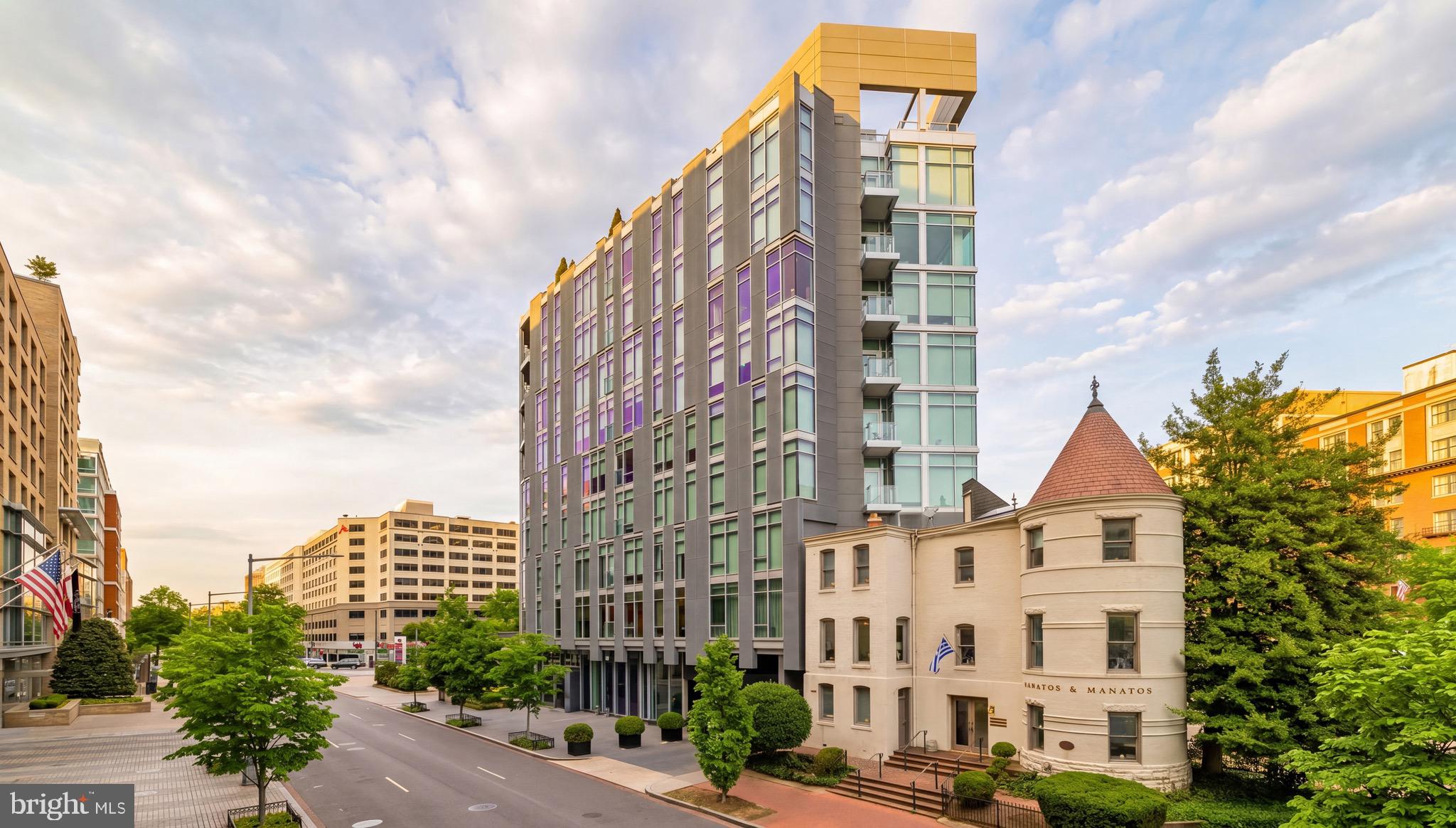 New Listing! A gem in Washington’s glittering West End, Residence 7E at 22 West is the epitome of luxury condominium living. Spanning nearly 2,500 square feet of abundant living space, the home generously showcases three bedrooms, three full baths, and a separate den. High ceilings create a flowing, expansive floor plan, revolving around an open concept central, large living and dining area, adorned with motorized shades covering the floor-to-ceiling windows, exquisite custom millwork, and striking fixtures. The space steps out onto a private balcony offering sweeping city views. 

At the heart of the home, the kitchen showcases sleek Poggenpohl cabinetry concealing a suite of SubZero and Bosch appliances to please the culinary enthusiast. Nestled within the private quarters, the primary suite is a spacious and tranquil retreat with direct balcony access. The lavish primary bathroom is clad in moody large-form stone tile and features a double vanity, glass shower, and separate soaking tub. Secondary bedrooms and bathrooms are finished to an equally elevated level. A laundry room with full-size side by side washer and dryer is tucked away within the unit and represents a truly coveted amenity in such a central urban location. Dedicated two-car side by side parking in the secure garage is another such amenity. 

A full-service building, 22 West promotes a luxury  lifestyle accentuated by hotel-grade amenities, including a 24 hour concierge, valet and porter services, an expansive rooftop pool, terraces for al fresco dining, common community space, and a fully equipped fitness center. Situated in the heart of West End amidst acclaimed eateries, luxury lodging, and popular retail, the location is truly unparalleled. A poster child for a distinguished urban lifestyle, Residence 7E at 22 West is for the most discerning buyer.