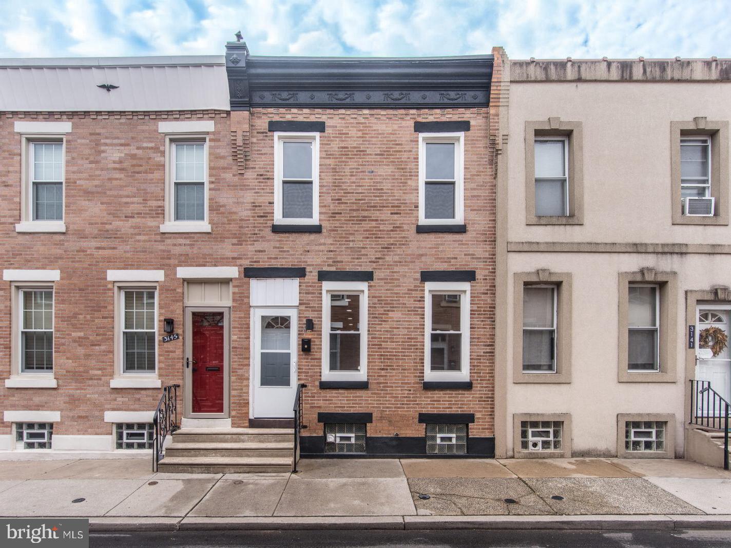 Welcome to 3143 Livingston Street, a beautiful and fully renovated from top to bottom 2 bed, 1 and a half bath home located in a prime location of Port Richmond.  Step inside to an inviting open-concept living area highlighted by new hardwood flooring that flows seamlessly throughout both the main and second levels. The spacious living area features a custom-built entertainment wall with an electric fireplace, creating a stylish and functional focal point.  The beautifully designed eat in kitchen offers high-end finishes including Taj Mahal-inspired quartz countertops, a ceramic tile backsplash, gooseneck faucet, and brand-new matching stainless-steel appliances.  There is also a first-floor bathroom fit for easy living and added convenience.  The second-floor features 2 bedrooms with good closet space, along with a spacious full bathroom complete with a stall shower featuring a rainfall shower head and built in shelving.  Recessed lighting, ceiling fan light fixtures, and tastefully designed accent wall trim details are thoughtfully incorporated throughout both levels.  The basement provides great storage space, while the kitchen offers direct access to a fully fenced rear yard featuring a spacious new concrete patio perfect for relaxing, entertaining.  Additional improvements include a new roof, new HVAC system (2026), new central air (2026), new windows (2026), as well as updated electrical and plumbing systems.  Ideally situated within true walking distance to shopping, restaurants, playgrounds, transportation, and convenient highway access. Enjoy nearby neighborhood restaurant favorites including Her Daughter's Cafe, La Roma, Aris Cafe, and Gaul & Co. Malt House.  Completely remodeled from top to bottom, this home showcases exceptional craftsmanship and thoughtfully selected modern finishes throughout.  Schedule your showing today and experience this Port Richmond gem for yourself.