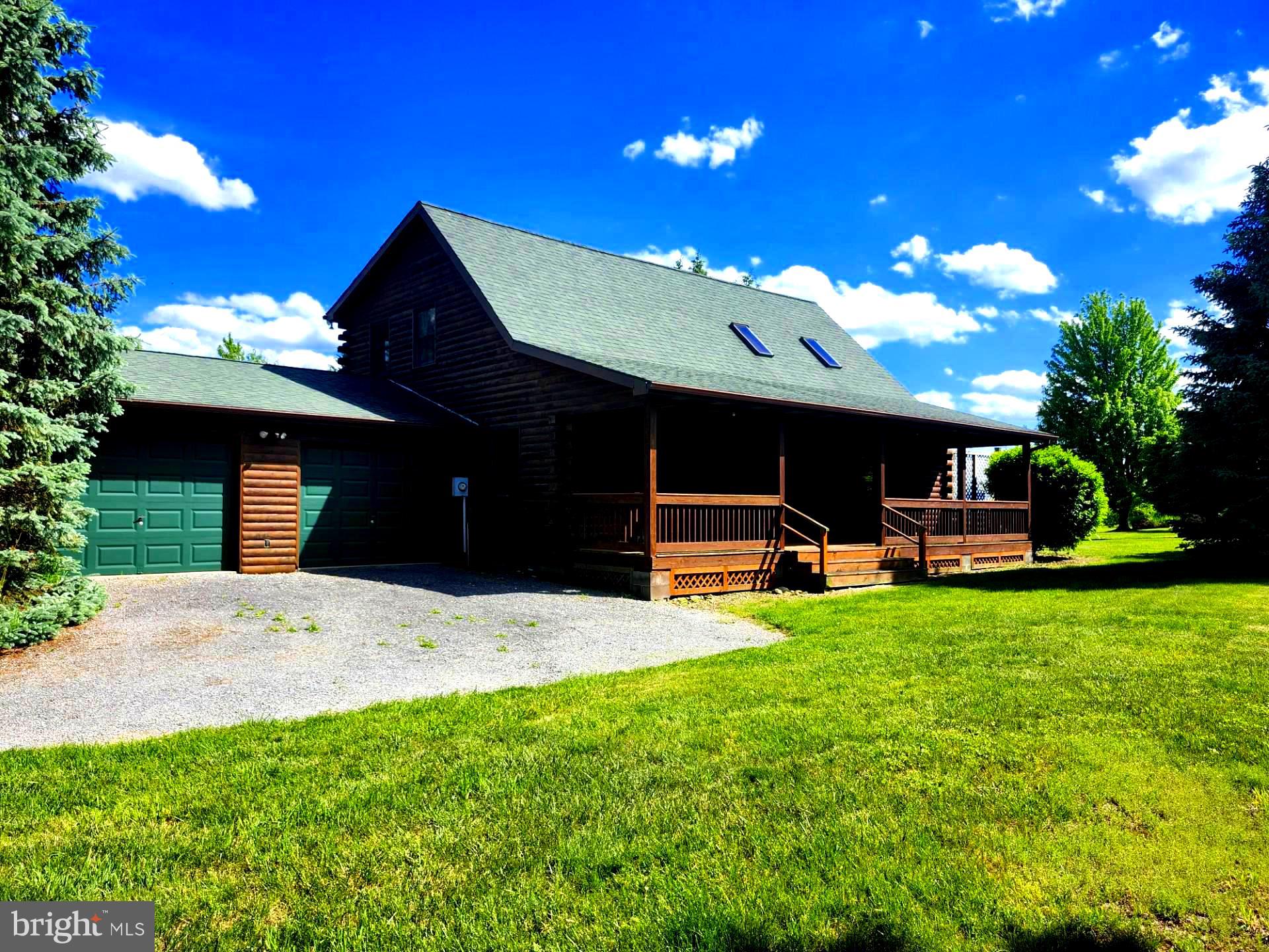 FEAST YOUR EYES ON THIS! A GORGEOUS (1960 SQ FT) CUSTOM LOG HOME WITH A MILLION DOLLAR VIEW! THIS PROPERTY IS METICULOUSLY LANDSCAPED  WITH A TREMENDOUS VARIETY OF TREES AND SHRUBS, AND OFFERS YOU ONE OF THE MOST BEAUTIFUL VIEWS YOU COULD POSSIBLY FIND.  THIS HOME WAS BUILT IN 1991 AND HAS SOME ABSOLUTELY GORGEOUS CUSTOM WOODWORK, LAMINATE PLANK FLOORING, TONGUE AND GROOVE FLOORING,  EXPOSED BEAMS, LOG WALLS, SKYLIGHTS, AND A BEAUTIFUL STONE FIREPLACE! EVERYTHING IN THIS HOME WAS TASTEFULLY FINISHED. THE HOME ALSO HAS A TWO CAR ATTACHED GARAGE. THE PROPERTY SITS ON LOT #99 (3.17 AC.)  IN HIGH MTN. ORCHARD AND HAS AN ADJACENT LOT WHICH IS AVAILABLE AS WELL LOT #98 (3.18 AC.) THERE ARE 3 ROOMS THAT HAVE NOT BEEN COMPLETED AS YOU WILL SEE IN THE PHOTO'S. THE LAUNDRY ROOM, AND THE UPSTAIRS BEDROOM AND BATHROOM HAVE NOT BEEN COMPLETED. THE HOME OPERATES OFF OF A CISTERN AND PRIVATE SEPTIC SYSTEM. THE WATER CISTERN IS AN 1800 GALLON TANK WITH A BRAND NEW PUMP. THE SHINGLE ROOF WAS REPLACED IN 2015, THERE IS A WRAPAROUND DECK COVERING 3 SIDES OF THE HOME, THE DECK COULD USE A LITTLE SPRUCING UP. DON'T WAIT AROUND, THIS HOME HAS TONS OF APPEAL, YOU MUST SEE THIS HOME TO APPRECIATE ALL THAT IT HAS TO OFFER!