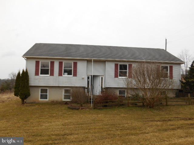 HUD Owned - Partially remodeled raised ranch home boasting country style kitchen, spacious living room, new deck, large garage all situated on 2.6 acres level land.