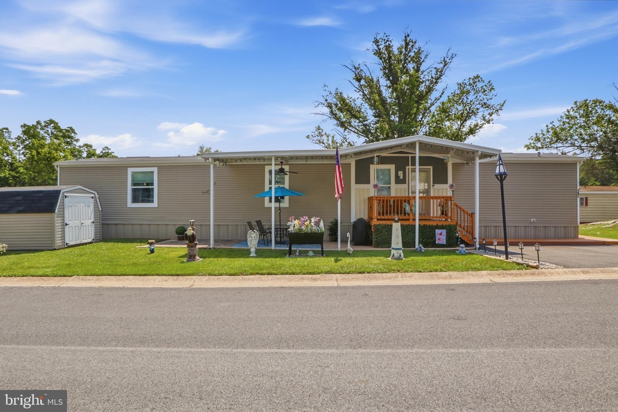 Opportunities like this don’t come along often! Own a beautifully maintained, 7-year-old, 3-bedroom, 2-full bath home for just $125,000. Thoughtfully upgraded and exceptionally cared for, this move-in-ready home offers the peace of mind as it has all been done for you.
From the moment you arrive, you’ll appreciate the inviting covered front porch with awning and the private patio, both thoughtfully added by the current owners to create wonderful outdoor living spaces. A storage shed provides plenty of room for lawn equipment and seasonal items, while the home backs to newer homes with trees in the distance, creating a peaceful setting.
Step inside to discover abundant natural light, and a welcoming foyer featuring decorative shiplap accents and built-in shelving. The spacious living room showcases dramatic floor-to-ceiling windows and an entertainment area perfectly designed for a large-screen TV.
Whether you’re preparing a quick meal or hosting friends and family, the thoughtfully designed kitchen offers beautiful 42-inch cabinetry, a large island with electrical outlets and pull-out shelving, a farmhouse-style double sink, decorative range hood, pendant lighting, a smooth-top electric range with a built-in air fryer (purchased in 2023 and still under warranty), dishwasher, and generous counter space. The island also provides additional seating, making it the perfect place to gather, enjoy your morning coffee, or catch up with family while dinner is being prepared.
The generously sized laundry room is both functional and attractive with additional cabinetry, shelving, and decorative shiplap accents.
Retreat to the spacious primary suite featuring a walk-in closet and an impressive private bath with double vanities, a soaking tub with built-in shelving that has never been used, and a walk-in shower with corner seating. The second full bathroom is equally immaculate, with the shower also never having been used.
Additional features include a brand-new HVAC system, high-end custom blinds and all window treatments, ceiling fans throughout, built-in shelving above both bathroom toilets, a Ring doorbell, and a swivel-mounted TV in the primary bedroom that is negotiable.
The monthly lot rent is $652 and includes water and sewer, while trash service averages approximately $80 per quarter. Even better, this section of the community is not located in a flood zone, so flood insurance is not required.
If you’ve been searching for affordable homeownership without sacrificing style, comfort, or quality, this is your opportunity. Offering three bedrooms, two full baths, thoughtful upgrades, and exceptional pride of ownership for just $125,000, this home is an incredible value and truly move-in ready! SELLER'S DISCLOSURE IS COMING!