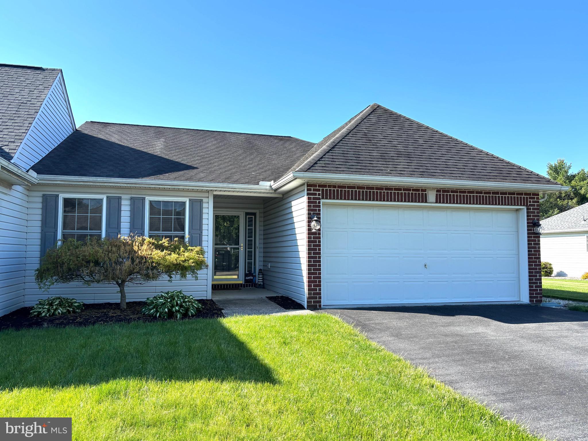 Welcome to 42 Ridgeway Dr, located in the highly desirable Cumberland Valley School District. Enjoy the ease and comfort of one-floor living in this well-maintained home, featuring two spacious bedrooms and two full bathrooms. The bright, open-concept layout is perfect for both everyday living and entertaining. Cozy up by the gas fireplace during the colder months, or relax on the peaceful backyard patio when the weather is warm. Additional highlights include an attached one-car garage and low annual HOA fees.