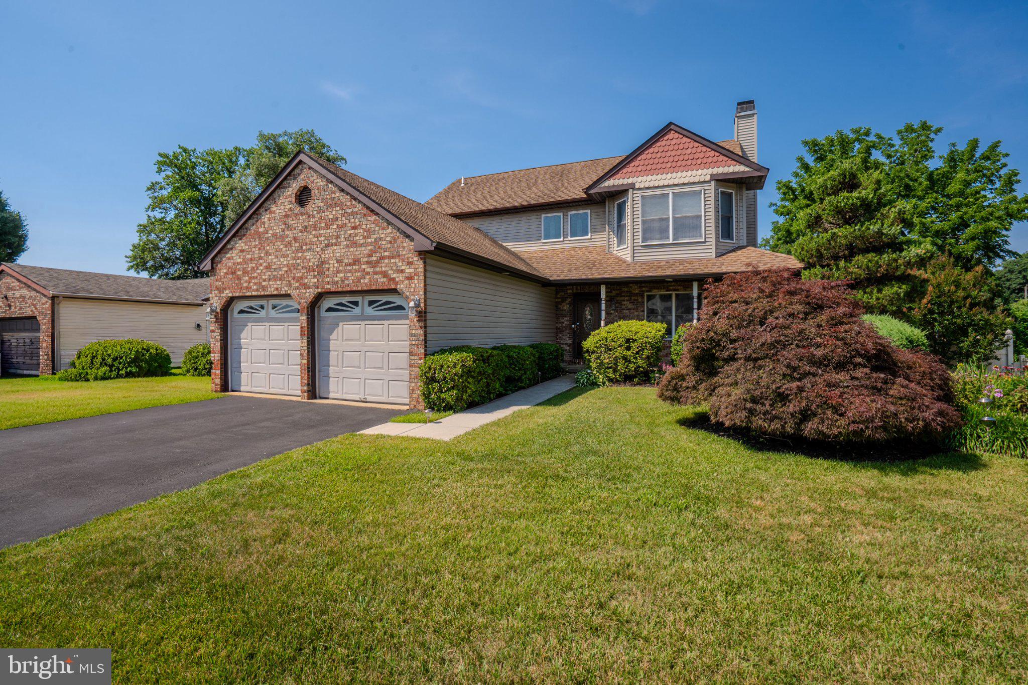 Welcome to this beautifully maintained 3-bedroom, 2.5-bath home nestled in Buck Hill Farms, one of Langhorne's most desirable neighborhoods, with a large community park just at the end of the street.

A welcoming two-story foyer with hardwood flooring leads into a thoughtfully designed floor plan featuring a beautifully renovated designer kitchen with granite countertops, stainless steel appliances, a double sink, center island with cooktop, abundant cabinetry, under-cabinet lighting, two pantries, soft-close doors and drawers, and specialty storage that any gourmet chef will appreciate.

The kitchen flows seamlessly into the spacious dining area, also featuring hardwood flooring, while both the kitchen and the spectacular family room showcase 18-inch tile flooring set on the diagonal. The dramatic family room features soaring vaulted ceilings, a cozy wood-burning stove, and two oversized, remote-controlled wood ceiling fans. French doors open to a large elevated TimberTech deck, perfect for entertaining or simply enjoying the private, fully fenced backyard.

The first floor also includes a formal living room with a fireplace, a convenient laundry room with additional storage, and an updated powder room with tile flooring.

Upstairs, you'll find a spacious landing, three generously sized bedrooms, a full hall bath, and a primary suite featuring a large walk-in closet and an en-suite bath with a relaxing soaking tub.

The full unfinished basement offers endless possibilities for future living space. One section beneath the family room addition was intentionally left without a concrete floor, providing the opportunity to install radiant heating and cooling, as well as plumbing for a future bathroom, before finishing the space to suit your needs. This area also features walkout doors leading directly to a concrete patio and the fully fenced backyard.

Beautifully landscaped flower beds in both the front and rear yards enhance the home's exceptional curb appeal. Additional upgrades include a new tankless water heater and furnace.

Ideally located near shopping, restaurants, parks, and major commuter routes, this move-in-ready home offers the perfect combination of comfort, style, space, and convenience. Don't miss the opportunity to make this exceptional property your new home!