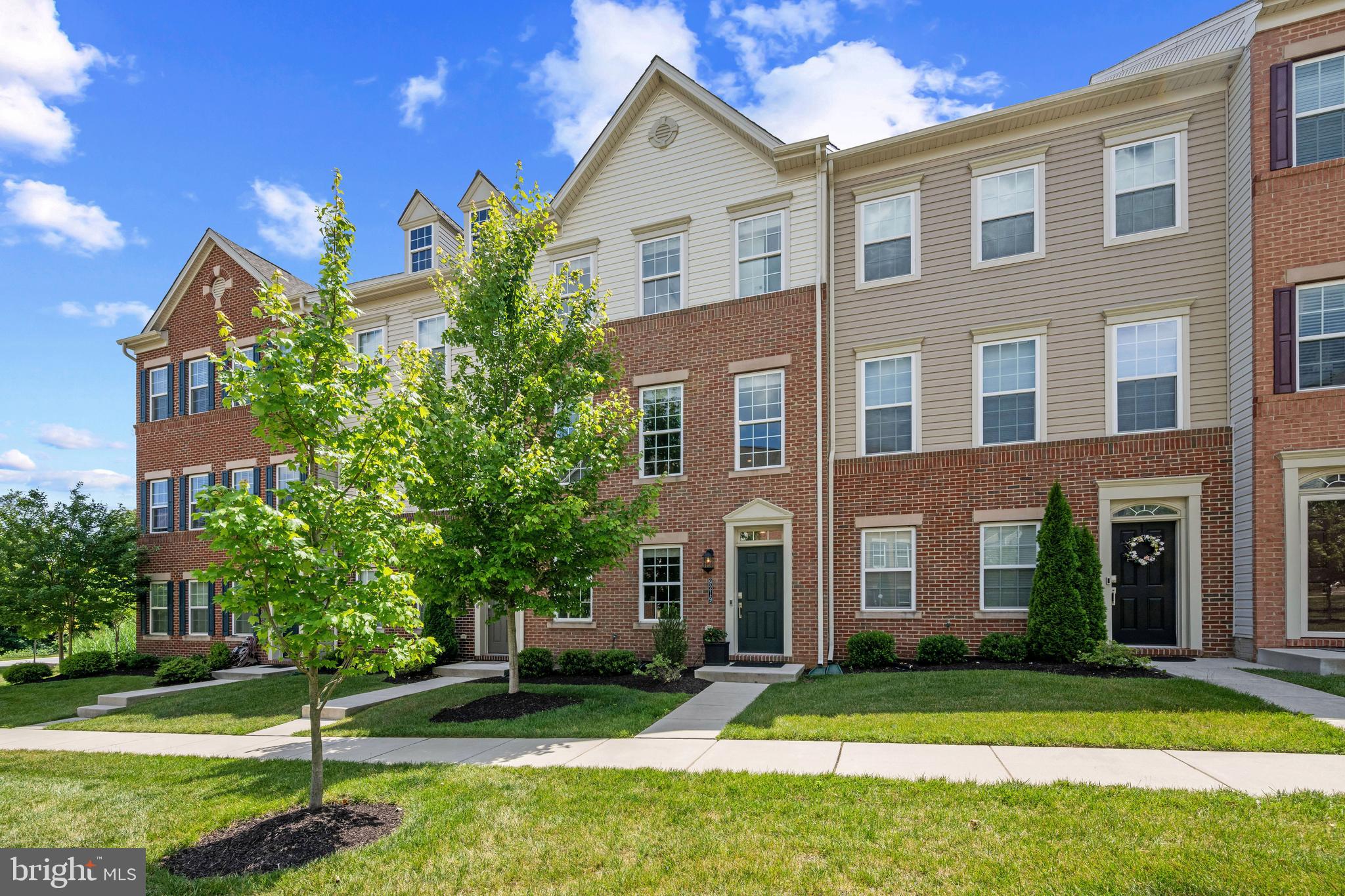 ***OPEN HOUSE***Sat, Jun 20 11:00 AM - 12:30 PM**Welcome to this exceptional three-bedroom, four-bath townhome in the highly sought-after Strawbridge Commons community. Perfectly positioned on a premium homesite, this beautifully maintained residence offers rare privacy, expansive views, and breathtaking sunset vistas with no townhomes directly behind. Enjoy peaceful outdoor living from the private rear deck overlooking mature trees and open green space, creating a serene setting rarely found in townhome communities. Designed for both comfortable everyday living and effortless entertaining, the open-concept floor plan showcases a gourmet kitchen featuring granite countertops, 42-inch white cabinetry, abundant storage, and generous prep space. Elegant, engineered wide plank flooring enhances the main living areas, while brand-new carpeting and high-end finishes throughout create a fresh, move-in-ready feel. The striking three-quarter brick front adds timeless curb appeal, while the finished lower level, complete with a powder room, offers flexible living space ideal for a recreation room, home office, fitness area, or additional living and entertaining space. Additional highlights include energy-efficient gas utilities, a spacious two-car garage, and a premier location on the community's main courtyard. Residents enjoy easy access to parks, walking trails, shopping, dining, and major commuter routes. Combining luxury finishes, exceptional privacy, scenic views, and one of the most desirable settings in Strawbridge Commons, this move-in-ready home offers a rare opportunity to enjoy low-maintenance living without compromising on space, style, or location.