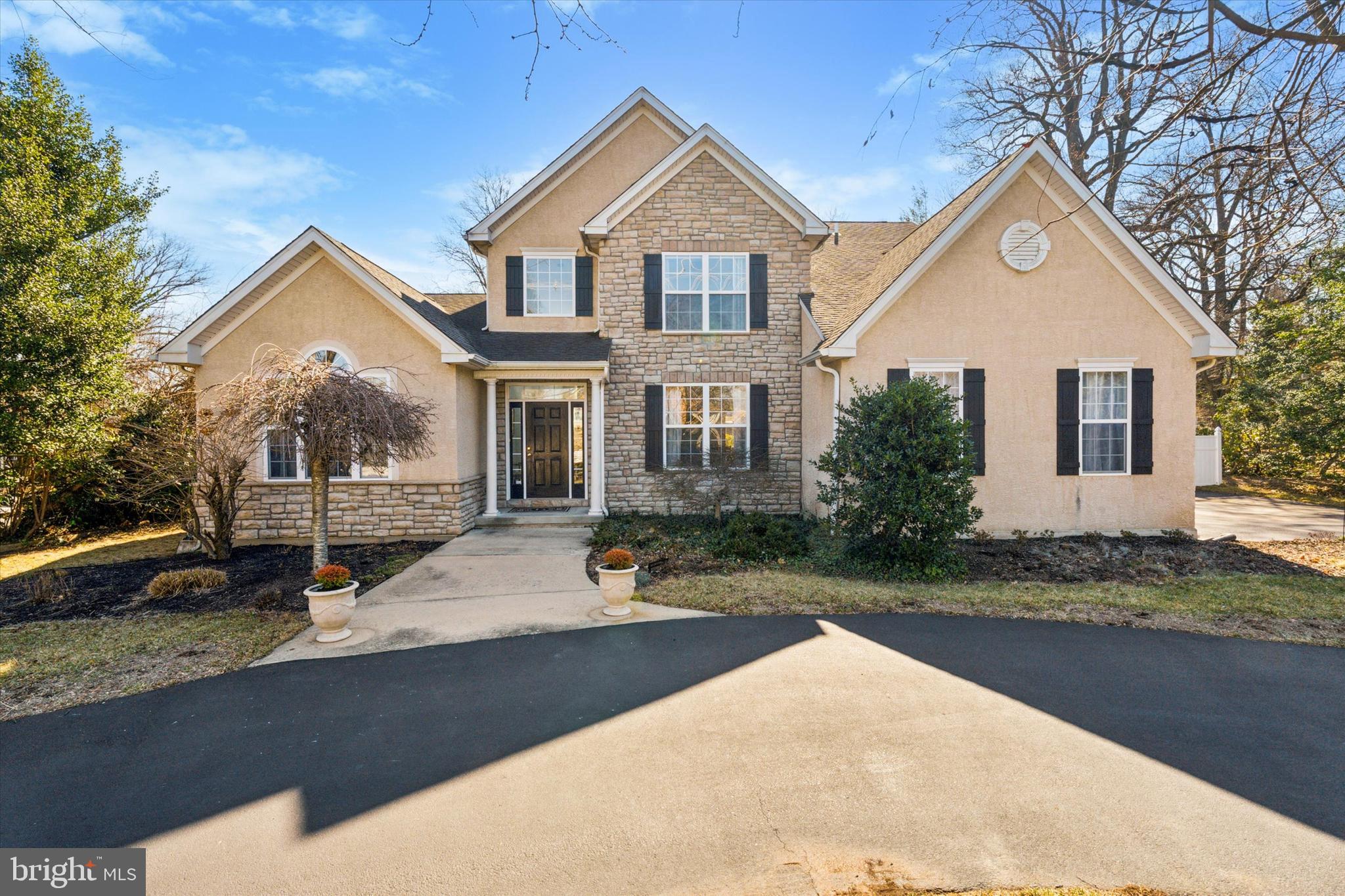 Welcome to 845 Washington Lane in prestigious Rydal, located in the Abington School District. This is a rare opportunity for a newer, well-constructed home boasting elegance and architectural design. It is a once-in-a-lifetime opportunity in an established, lush neighborhood as Rydal. As you enter the home from the circular driveway you will be greeted by the grand two-story foyer boasting gleaming hardwood floors that continue throughout the main level.  Just off the foyer, you will be welcomed by the formal living room showcasing a cathedral ceiling, large Palladian window, and a spacious and brightly lit dining room for all your family and holiday gatherings. As you leave the foyer, you will be mesmerized by a spectacular great room boasting a gas fireplace, a complete wall of oversized sun-filled windows, and impressive 18-foot ceilings.  The great room flows openly into the newly updated kitchen showcasing a large island, extensive white cabinetry, granite countertops, beautiful tile backsplash, and stainless-steel appliances, including a newer dishwasher and refrigerator, pantry, matching decorative lighting, and a bonus mini bar with fridge. There is also a delightful breakfast area with triple glass doors leading outward to a Trex deck and a spacious hardscape patio for outdoor gatherings.  Continuing through the main floor is a beautiful owner’s suite offering a luxurious bathroom, double sink vanity, soaking tub, and a spacious walk-in-closet topped off by triple windows. Completing this level is a powder room, laundry area, and side entrance to the oversized two-car garage.  Ascending to the second floor via the wide-turned staircase, you will encounter two spacious bedrooms, each with an abundance of fitted closets. The loft is currently an office that can be converted into a fourth bedroom. Completing this level is a newly updated full bathroom with a gorgeous colorful tile wall over the tub, a double sink counter height vanity, and Karastan carpets throughout. The massive unfinished basement offers a tremendous possibility for expanding your family and recreational needs with its high ceilings, superior concrete walls, and an egress window. This property is very close to Whole Foods, Trader Joe's, Abington Art Center, the Hiway Theater, and an abundance of fabulous dining and shopping in and around the area.  A quick walk to the Noble train station for an easy commute into the city by train makes this an ideal suburban living. Make your appointment today to preview this lovely home!