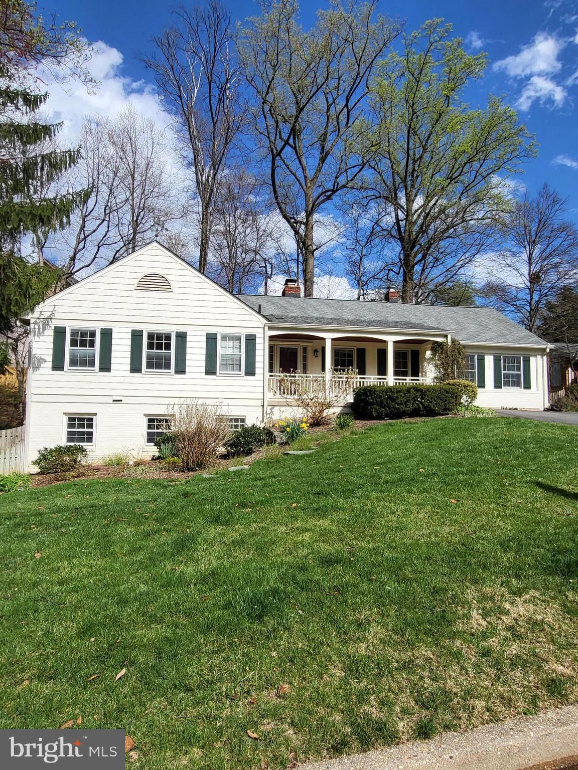 Opportunity to purchase this charming English-Ranch style home in Country Club Hills.   Bring your creativity and ideas to make it your own!  Stunning back yard with mature plantings reminiscent of an English-country garden and in keeping with the character of the property.  Flexible floorplan with 4 beds/3 baths. Spacious entry level opens to living room with wood-burning fireplace,  sunroom with beautiful slate-tile flooring and 3-walls of windows, three bedrooms including primary bedroom w/en-suite bath and hall bathroom.  Take the stairway down to a remodeled kitchen, separate dining room,  den/library/sitting room with  garden views and a wood-burning fireplace plus a  large bedroom and full bath. This level of the home can also be accessed by a second exterior entry allowing for one level living.