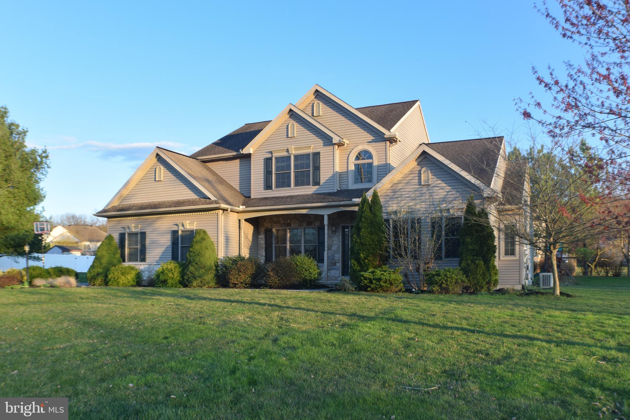 Instantly feel at home in this beautiful house built by Landmark Builders located in Palmyra Area School District.  The covered front porch welcomes you inside to a 2-story foyer that extends into the great room featuring a vaulted ceiling and a wall of windows surrounding a stone gas fireplace. The open, eat-in kitchen with breakfast bar and sliding glass doors to the level backyard provide easy access for entertaining and play.  The main-level owners suite with a spacious tiled bathroom includes a jetted tub and separate shower and offers the perfect opportunity for one-story living.  A formal dining room and office complete the first floor.  Maintenance-free luxury vinyl plank flooring and 9-ft. ceilings carry throughout most of the main level.  The second floor has new carpet throughout and features three large bedrooms and a full bath.  The finished basement provides additional living space and ample storage.  The unique community of Falcon Ridge offers direct access to the Lebanon Valley Rail Trail for biking and hiking to The Jigger Shop, Mt. Gretna Lake and Playhouse and all the amenities Mt. Gretna has to offer.  Appreciate the benefits of living in a neighborhood while enjoying picturesque views of open fields and woods of State Game Lands with the assurance this land will remain undeveloped.  A whole-house generator and energy-saving solar panels will convey to the new owner.  A one-year home warranty is included for peace of mind.  Special Financing Incentives available on this property from SIRVA Mortgage.