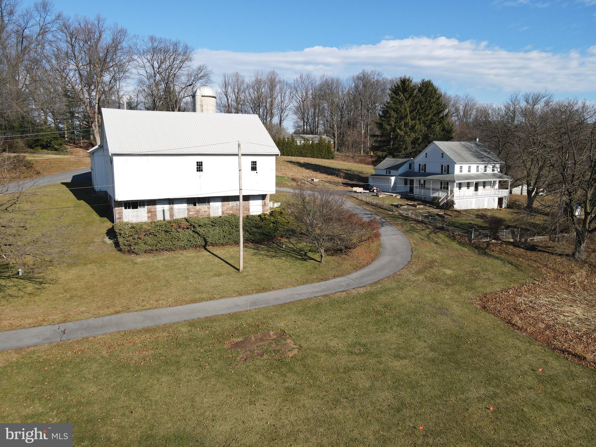 This property will be offered at Public Auction on Saturday, March 8, 2025 @ 10am.  The listing price is the opening bid only and in no way reflects the final sale price.  10% down due at auction, 2% transfer tax to be paid by the purchaser, real estate taxes prorated. Nestled amidst scenic farmland, this picturesque farm offers 25 acres of tillable land, with the remainder consisting of woodlands. Conveniently located with easy access to Routes 72 and 76, this property provides both privacy and accessibility. The two-story farmhouse features a cozy living room, a eat-in kitchen, an office space, a laundry area, and a full bathroom on the main floor. Upstairs, you'll find three bedrooms and a full bathroom. Outbuildings include a tobacco barn, a bank barn, and multiple storage sheds, providing ample space for farming and storage needs. Don’t miss this great opportunity in Rapho Township!
There is a utility easement for an electric company located on the property as well as a parking lot, all owned by Mt. Hope Nazarene 
Retirement Community.
