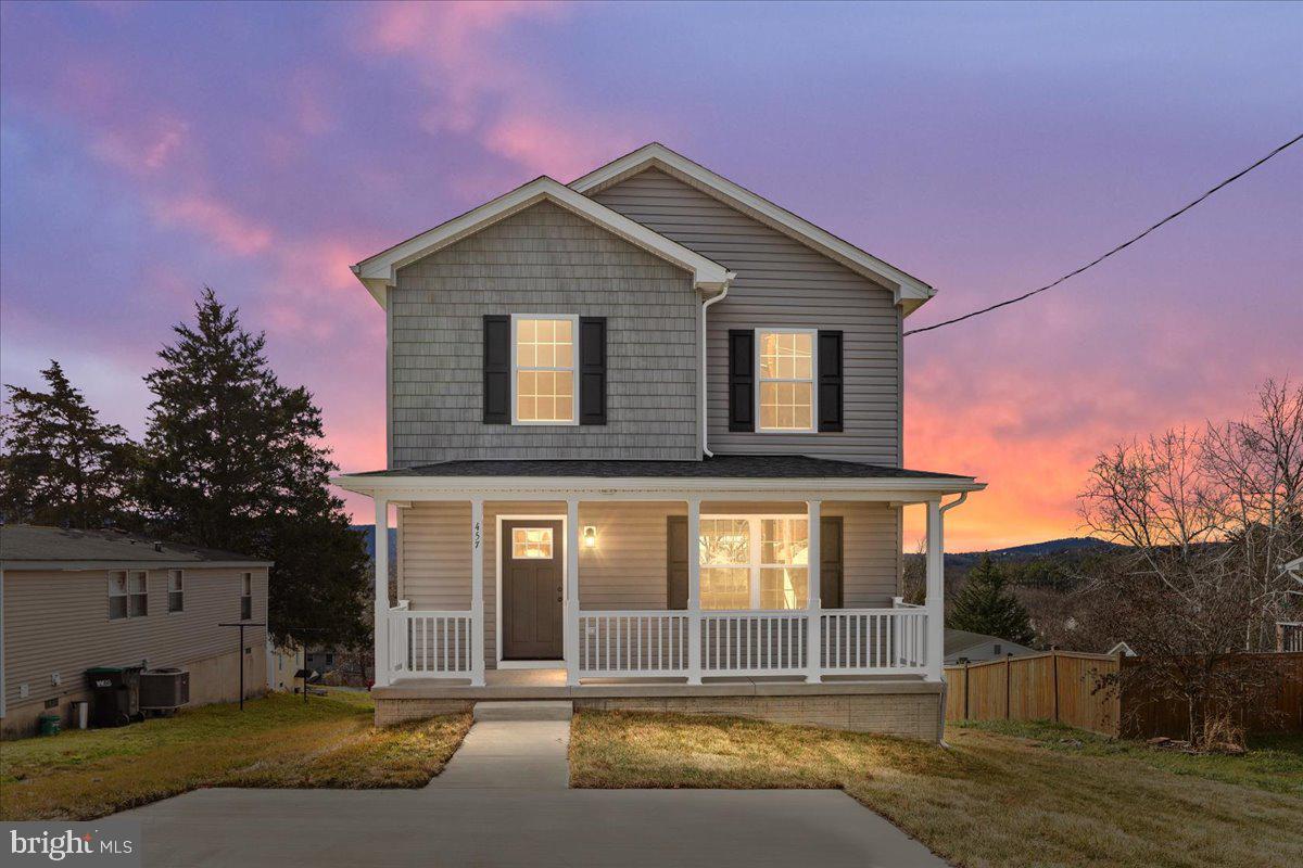 Welcome home to this charming and newly constructed residence on East Locust Street in scenic Woodstock, Virginia.  With an open floor plan, this two story Colonial boasts the perfect blend of comfort, style, and functionality.  Featuring three generously sized bedrooms and two and a half bathrooms, this home offers ample space for both relaxation and entertaining.  Enjoy the private rear deck, providing an ideal setting for morning coffees or evening gatherings with family and friends.  Embrace the allure of new construction—make this home your sanctuary.