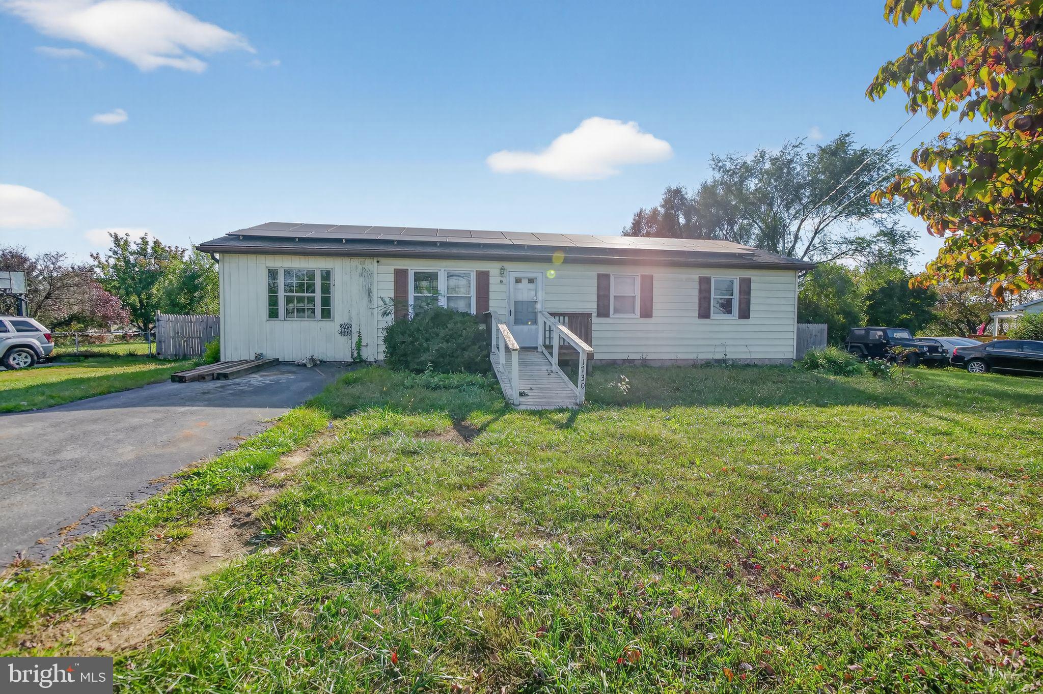 PRICE DROP-BRING OFFER!
Large fenced yard, rear deck with views, and room to update to your taste! 
Located in the Nadenboush community of Inwood, WV, this charming 3-bedroom, 2-bath ranch-style home offers more than just square footage. It delivers the kind of backyard views and quiet surroundings rarely found at this price point. 
The interior is filled with natural light and features a practical floor plan that includes carpeted bedrooms, a ceramic-tiled bathroom with a Corian vanity top, and a generously sized kitchen with ample cabinetry and workspace. There's clear potential to add value through modern updates, making this an excellent opportunity for buyers who aren't afraid of a little vision and elbow grease.
The home includes an attached carport, paved driveway, and a large fenced yard that backs to open land, offering privacy and room to roam. Outdoor spaces include a covered front porch and a private rear deck — both ideal spots for morning coffee or evening sunsets. While some cosmetic updates and repairs are needed, the home has been well cared for and provides a solid foundation for personalization.
Just minutes from I-81 and close to Martinsburg, this location offers quick access to shopping, restaurants, schools, and commuter routes, all while retaining a peaceful, rural feel. 
It's an ideal property for first-time buyers, downsizers, or investors looking for a manageable project with long-term upside.