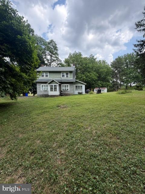 Same owner since the 1970's - this cute cottage (known to be one of the oldest homes in the Twp) is nestled on just over 2 acres; private setting with mature trees, an old chicken coop and storage shed.  The main floor consists of an eat in kitchen with electric cooking, dishwasher and tile flooring.  The cozy living room with hardwood floors and a wood burning fireplace is a perfect setting to snuggle up with a book.  Although the study/office may be the best place to hang out with views of the yard.  The upstairs has two bedrooms; one has an attached sitting room or could be a walk through bedroom or great closet space.  The full bath is on the second floor.  The home is barely visible from the road; you enter down a stone driveway.  Please do not enter without a scheduled showing.  A quaint country setting you'll be proud to call Home.