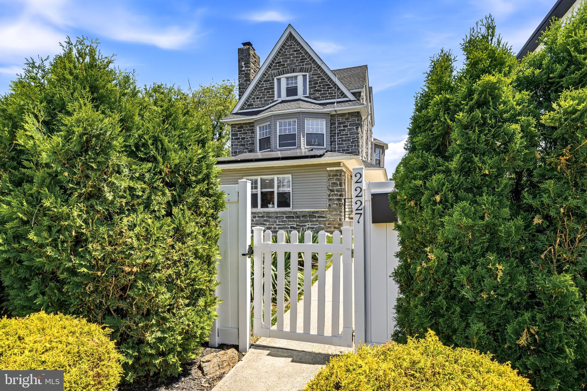 New Price!

Step inside 2227 N. 54th Street and you'll feel it right away—a welcoming sense of history, character, and possibility. This beautifully crafted stone residence, built in 1925, reflects an era when quality workmanship and timeless design mattered, while a thoughtful 2020 renovation brings the home comfortably into modern living.

With more than 4,100 square feet, seven bedrooms, and three-and-a-half baths, this move-in ready home offers exceptional value and room to truly live. Rich oak hardwood floors flow throughout much of the home, while soaring ceilings, generous natural light, and gracious room sizes showcase the charm and craftsmanship rarely found in newer construction.

At the heart of the home, the well-appointed kitchen features granite countertops, stainless steel appliances, abundant cabinetry, and ample workspace, creating a functional and inviting space for everyday living and entertaining. Multiple living and gathering areas, along with a finished basement, provide the flexibility today's buyers need for work, recreation, guests, or multigenerational living.

Adding to its unique story, the home carries a subtle connection to Philadelphia history through ties to the family of Chuck Barris, offering an interesting piece of local heritage woven into its lineage.

Ideally located in Wynnefield, the property offers the perfect blend of suburban comfort and city convenience. Enjoy easy access to Center City Philadelphia, City Avenue, I-76, Route 1, and regional rail service. Nearby destinations include beautiful Fairmount Park, as well as renowned institutions such as Saint Joseph's University, Villanova University, and Haverford College. The location is also convenient to leading medical centers including Lankenau Medical Center, Bryn Mawr Hospital, and Penn Medicine.

A rare combination of size, character, location, and value, 2227 N. 54th Street is ready to welcome its next chapter.