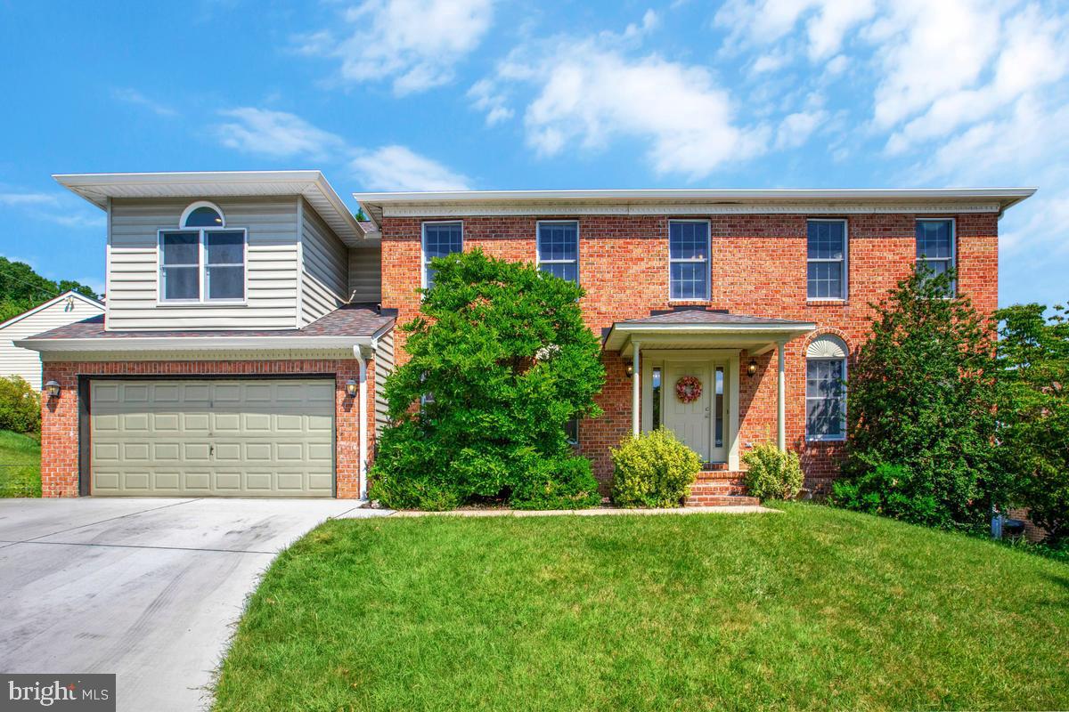 PUBLIC OPEN HOUSE SUNDAY,  JUNE  28th,  1-3PM.      Welcome  home to this  SPACIOUS AND BEAUTIFULLY updated 5 bedroom, 2 Full and 2 half bath home, ideally  located on the Perry Hall line and zoned for Perry Hall schools- with  NO HOA!! Freshly painted with brand-new carpet throughout, this impressive home features GRANITE countertops, STAINLESS STEEL appliances, a COZY FIREPLACE, and an abundance of living space, including TWO FAMILY ROOMS, a separate DINING ROOM, and an EAT-IN KITCHEN. The OVERSIZED 2 -CAR GARAGE  leads into a LARGE MUDROOM, adding everyday convenience and extra storage. The oversized primary suite offers a LUXURIOUS BATH WITH JACUZZI TUB, separate shower, WALK-IN CLOSET, and a PRIVATE SITTING ROOM perfect for a nursery, home office, or retreat. All five bedrooms and the convenient UPPER-LEVEL LAUNDRY ROOM are located on the same floor. Enjoy a deck overlooking peaceful wooded views and a charming backyard. The enormous unfinished basement offers endless possibilities for future living space, recreation, or storage. A rare combination of space, updates, location, and value!  This is that big affordable house you have been looking for!! Great for multi-generational families with 2929 finished square feet  with potential of 4129 sq ft!!