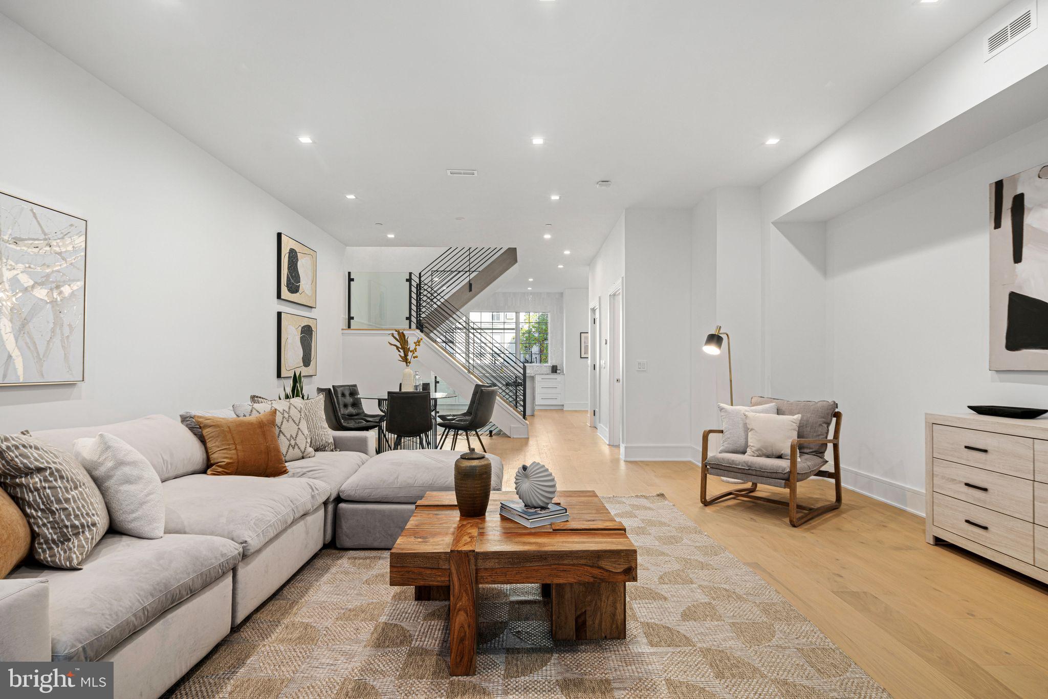 ***LAST HOME AVAILABLE***Introducing Cypress Commons, an exceptional collection of nine new-construction luxury townhomes in the heart of Washington Square West, with a late Summer 2026 delivery.
Washington Square West is one of Philadelphia’s most captivating and established neighborhoods, known for its historic charm and modern vibrancy. Picturesque, tree-lined streets are framed by beautifully preserved rowhomes, creating a timeless and inviting atmosphere. With close proximity to iconic landmarks, acclaimed dining, and a strong sense of community, Wash West offers a true urban oasis that seamlessly blends past and present. Cypress Commons is tucked into a charming street deep within the neighborhood, offering an exclusive townhome enclave. Each residence spans approximately 4,502 square feet of thoughtfully designed living space. The ground-floor entrance provides direct access to an attached two-car garage and opens into a spacious foyer. The lower level features a full bathroom and two generously sized finished spaces, ideal for a home office, gym, or media room. The second floor showcases a state-of-the-art chef’s kitchen with tastefully muted cabinetry, exquisite quartzite countertops, and a premium Wolf/Sub-Zero appliance package. An open-concept layout seamlessly connects the kitchen to the living room, dining area, and a convenient powder room. Double sliding glass doors lead from the living room to a private balcony, perfect for entertaining. The third floor is designed for comfort and functionality, featuring a well-appointed laundry room with a folding station and laundry sink, along with two spacious bedrooms—each offering en-suite bathrooms and walk-in closets. The fourth floor serves as a private primary suite retreat, complete with an oversized walk-in closet and a spa-inspired bathroom featuring an oval soaking tub, marble tile, heated floors, and a spacious rail-head shower with multiple sprayers and a handheld attachment. Enjoy rooftop serenity from your private roof deck, where sweeping views of Philadelphia’s skyline and nearby historic landmarks create the perfect backdrop for entertaining or relaxing. Cypress Commons is ideally located near some of the city’s most celebrated restaurants and neighborhood favorites, including Vetri Cucina, Talula’s Garden, Green Street Coffee Co., and Little Nonna’s. Homes are equipped with smart-home technology, including a Schlage keyless entry lock, Google Nest thermostat, Ring video doorbell, and a smart garage door opener—all easily managed from your smartphone. Each home includes a 10-Year Real Estate Tax Abatement under Councilmanic Ordinance 1456-A, Section 19-1303.4 of the Philadelphia Code, as well as a one-year builder’s warranty for added peace of mind. Don’t miss your opportunity to own a luxury townhome at Cypress Commons—where modern design meets classic Philadelphia living in the heart of Washington Square West.