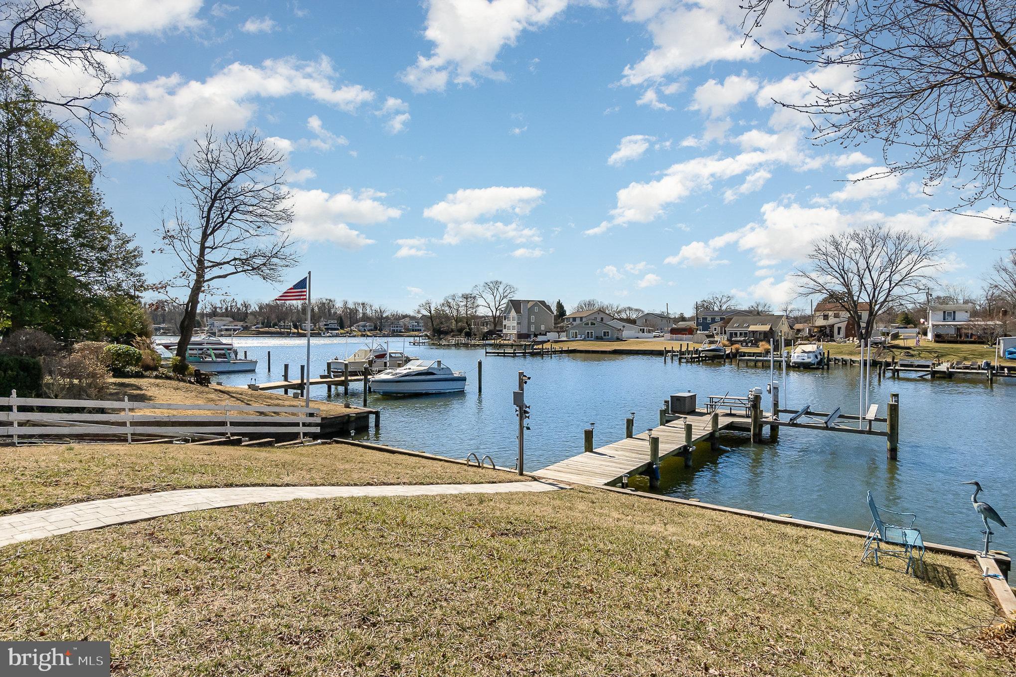 Coastal Charm at Its Finest! This stunning three-story, 3-bedroom, 3.5-bath coastal-style home offering approximately 3000 sq. ft. of living space and is just 11 years young—still SHOWS LIKE A MODEL!
Situated in a prime waterfront location on Norman Creek just seconds off the Middle River and minutes to the open Chesapeake Bay. The home offers breathtaking views while providing natural protection and safe harboring—a rare find that minimizes maintenance and tidal upkeep compared to the big open-water property views. The open-concept floor plan is exactly what today's buyers are in search of in the market! The customized kitchen features ample cabinetry, stone countertops, and top-tier finishes, flowing seamlessly into the spacious family room. Just off the main living area, enjoy a spectacular 25’x12’ maintenance-free screened-in porch—perfect for relaxing and entertaining. Water lovers will be thrilled with the 50-ft. pier equipped with electric and water, plus a 10,000-lb. electric boat lift (only 3 years young!). Bring your boat, paddleboards, kayaks, PWC, and traps—this is waterfront living at its best! Additional highlights include:
Partially finished basement with a full bath—ideal for guests! No flood insurance required—thanks to a gradual, sloping yard elevation. Attached 22' x 19' garage and oversized yard—great for entertaining and extra parking. Paver patio for even more outdoor enjoyment. Opportunities like this don’t last—act fast! This is "The Land of Pleasant Living" at its safest and finest!