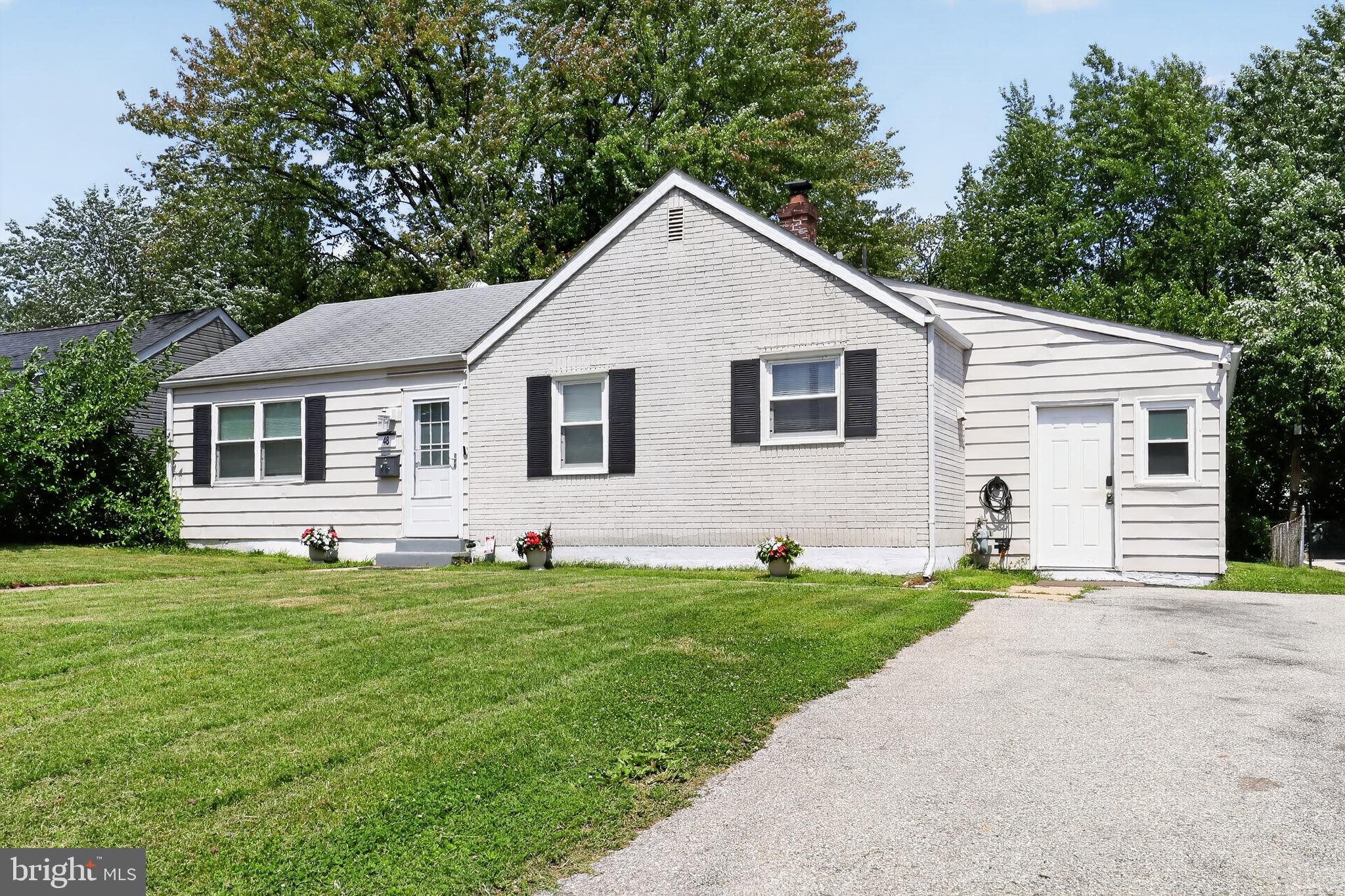 Welcome to 48 Yale Avenue, a move-in ready 3-bedroom, 1-bathroom single family home in the Wilmington Manor Gardens neighborhood of New Castle. Offering a flexible layout, fresh interior paint, and a spacious yard, this home is ready for its next owner. As you approach the home, you'll be greeted by an inviting front yard and a convenient two-car driveway. Inside, the welcoming foyer features tile flooring, a chandelier, and new lighting fixtures that continue throughout the home. To the left, the dining room offers tile flooring, two bright front-facing windows, and a chandelier, creating a comfortable space for everyday meals and entertaining. Just beyond, the kitchen features tile flooring, white cabinetry, stainless steel appliances, a new dishwasher installed in 2026, and a functional layout designed for everyday convenience. Adjacent to the foyer, the living room provides a comfortable gathering space with plenty of natural light. Off the foyer, you'll find the primary bedroom, featuring tile flooring and French doors that add character while creating a bright and inviting retreat. Two additional bedrooms provide comfortable accommodations for family, guests, or a home office. The updated full bathroom features new luxury vinyl plank flooring and a tub/shower combination. Additional updates include a new water heater installed in 2026, keyless entry on the side door, and smart Alexa-compatible light bulbs throughout the home for added convenience. Step outside to enjoy the spacious backyard, complete with a storage shed with electricity and plenty of room for entertaining, gardening, pets, or simply relaxing outdoors. Conveniently located near shopping, grocery stores, restaurants, parks, and everyday amenities, this home also offers quick access to I-295 and I-495, making commuting throughout the area simple and convenient. Don't miss the opportunity to make 48 Yale Avenue your next home.