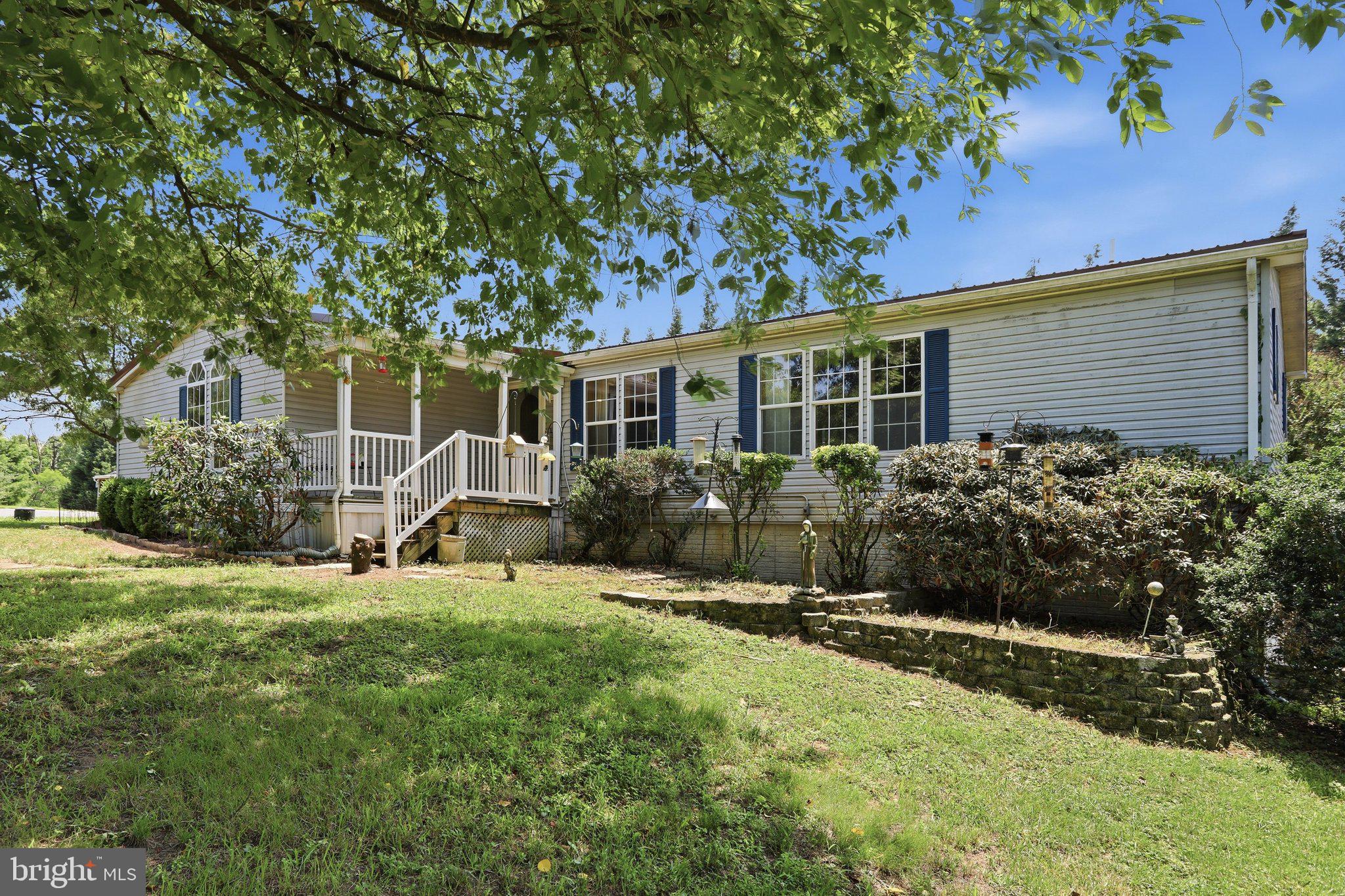 Prime 13.5+ Acre Estate: Unlimited Commercial Potential & Massive Living Space!
136 Snooks Lane, Martinsburg, WV 25405

Price: $599,999.00 (Priced to Sell As-Is)

Specs: 3 Bedrooms | 3 Bathrooms | 3,000+ Sq. Ft. | 13.56 Acres | No Restrictions

The Opportunity of a Lifetime
Opportunities like this do not come around often. Situated on 13.56 breathtaking, private acres with absolutely no restrictions, this prime piece of Martinsburg real estate is a blank canvas for your dreams. Whether you are looking for an unmatched private homestead or the perfect commercial lot to launch or expand your business, this property delivers.

The Land & Outbuildings
The acreage itself is stunning, offering a perfect blend of privacy and accessibility. For business owners, hobbyists, or craftsmen, the property is already equipped with fantastic infrastructure:

Dedicated Woodworking Sheds: Outfitted and ready for your projects, trade, or storage needs.

Additional Bonus Sheds: Ample room for equipment, tools, or inventory.

Commercial Vision: With over 13 acres of unrestricted land close to everything, it makes an ideal spot for a commercial shop, yard, or specialized business venture.

The Residence: Over 3,000 Sq. Ft. of Living Space
Nestled on the property is an expansive, beautifully updated doublewide home resting on a permanent foundation. Offering a spacious, open layout, this home features:

Fresh Updates: Brand new carpet runs throughout the entire home.

Generous Floorplan: 3 spacious bedrooms and 3 full bathrooms.

Bonus Living Space: A massive, custom-added family room provides the perfect central gathering space.

Deep Potential: A huge, partially finished basement adds incredible square footage, waiting for your final personal touches, a home gym, or massive extra storage.

Unbeatable Location
Enjoy the peace and quiet of a deeply private, expansive acreage without sacrificing convenience. You are just minutes away from local shopping, dining, schools, and major commuter routes—truly the best of both worlds.