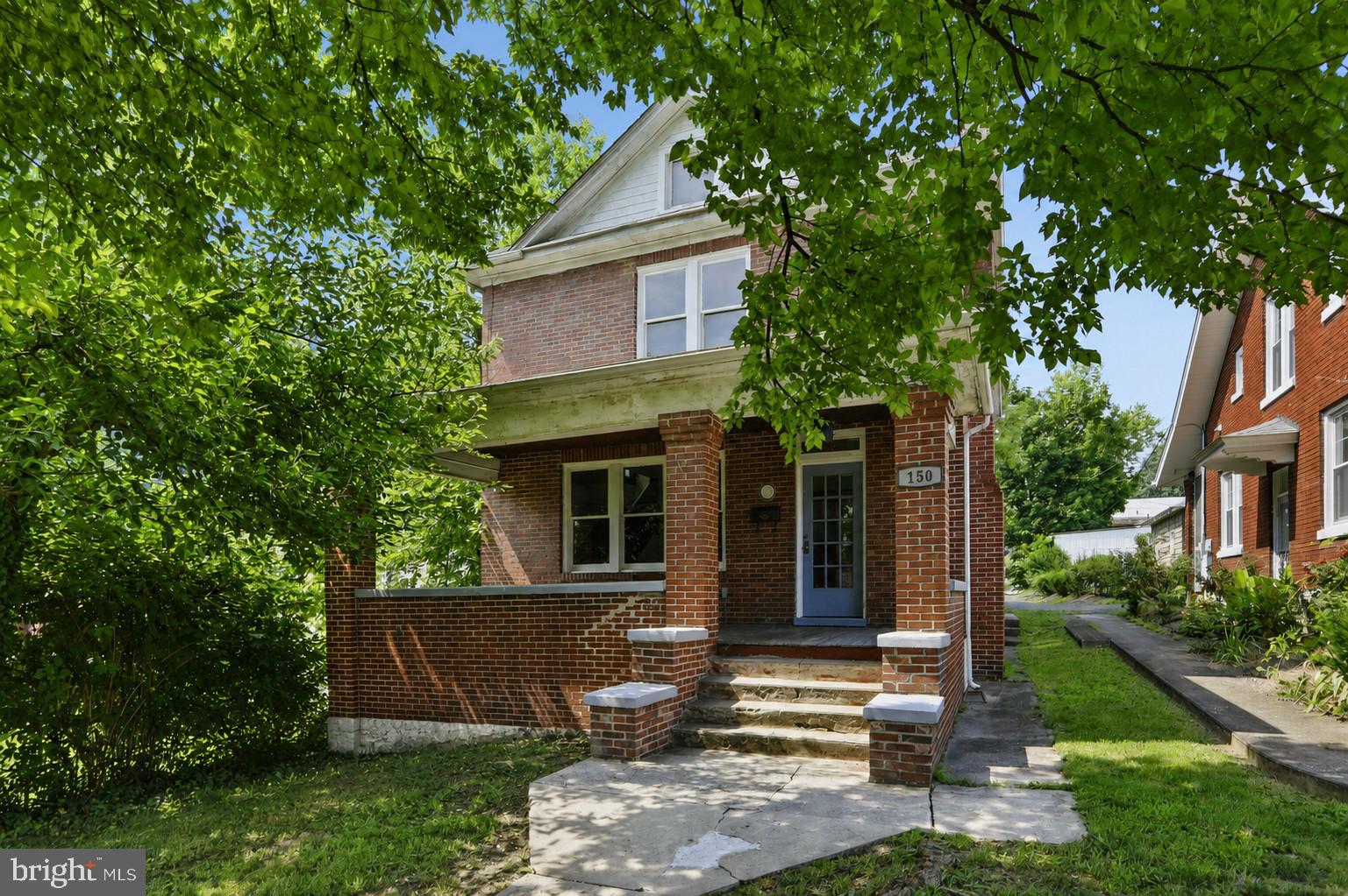 Nestled beneath a canopy of mature shade trees, this timeless two-story brick home is overflowing with character and charm. Step inside to discover stunning original hardwood floors, rich wood trim, elegant moldings, and beautifully preserved craftsmanship that simply can't be replicated. Spacious living areas, classic architectural details, and a warm, inviting atmosphere make this home the perfect blend of historic elegance and everyday comfort. If you've been searching for a home with personality, history, and lasting quality, this is one you won't want to miss.