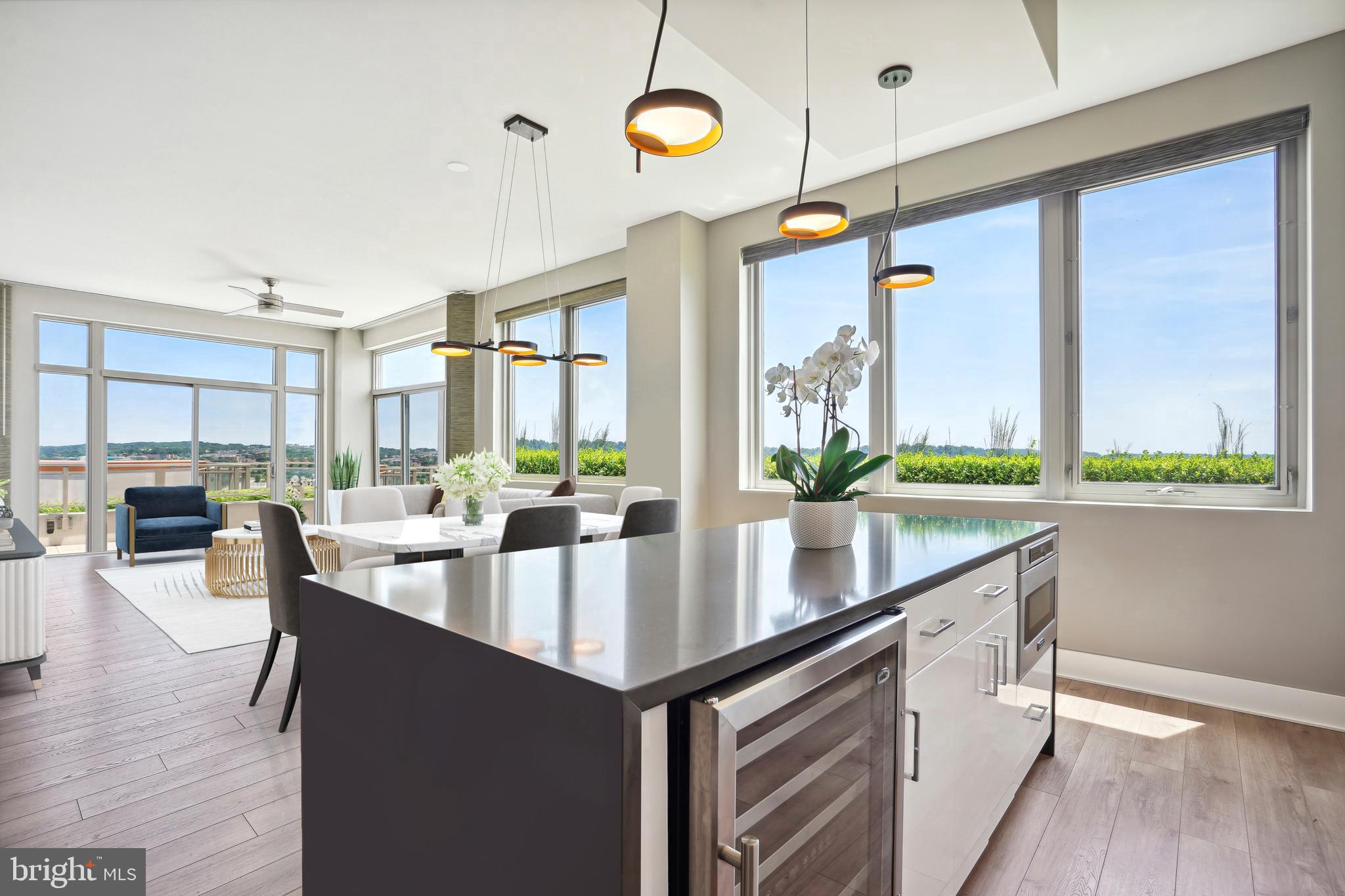 A Waterfront Asset with Unmatched Scale

Experience the crown jewel of Peninsula 88. Penthouse #1 is not simply a residence; it is a strategic acquisition in DC’s most transformative waterfront corridor. Boasting a rare 270-degree panoramic vista, this 1,850 sq ft home is defined by its massive 455 sq ft private, open-air terrace—the largest in the building with access from every room of the residence, zero overhead obstructions, offering unrivaled panoramic horizons and a true open-air sanctuary.

***Unparalleled Design & Convenience: Beyond the breathtaking views of the Anacostia and Potomac Rivers, PH1 offers a unique "triple-threat" of value:
***Expansive Outdoor Living: The terrace functions as a secondary living room, accommodating a full 8-person dining set and a fire-pit lounge—all with direct access from every room in the home.
***The Logistics Advantage: Includes two "VIP" extra-large parking spaces (no adjacent cars) and a massive 8'x6' storage unit, both strategically located next to the elevators for maximum convenience.
***Effortless Ownership: Positioned in a LEED Silver building with an efficient fee structure, this property is designed for both effortless high-end personal use as well as high-demand executive rental with long-term asset appreciation potential.

National Park Activation: Ideally positioned for the long-term holder, PH1 sits adjacent to the newly activated $10M+ National Park Service rehabilitation project. With federal contracts for the park’s transformation now underway (2026), this residence offers a unique "front-row" advantage as Buzzard Point matures into DC’s premier recreational waterfront. The upcoming Anacostia Riverwalk Trail extension will soon provide seamless pedestrian connectivity directly behind the building.

The Interior Experience: Floor-to-ceiling 9-ft windows frame the river from every vantage point. The residence features 6.25” wide-plank wood flooring, a chef’s kitchen with Viking appliances, and a quartz waterfall island. Recent upgrades include a reverse osmosis water system and remote-controlled window treatments throughout the home.

Community & Location: Peninsula 88 This LEED Silver building offers a host of low-fee amenities: a top-floor community room and sky terrace with fire pits, billiard table, and grills; Onsite Building Manager & Remote Concierge; electric car charging; dog wash; and secure kayak storage. Embrace luxury waterfront living within walking distance of Nats Park, Audi Field, and the burgeoning retail at The Stacks.