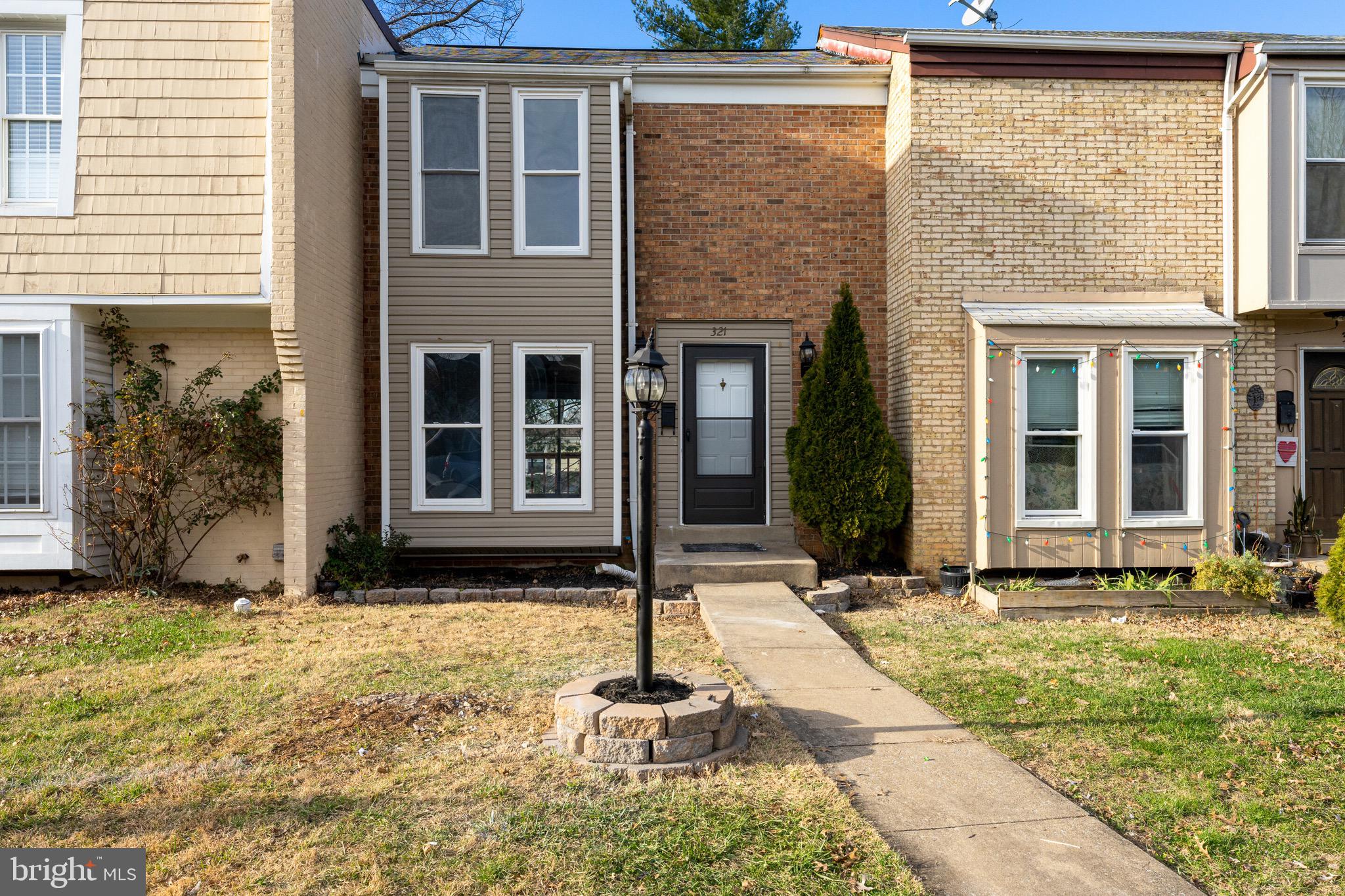 Beautifully updated 3 Bedroom, 2 Bath interior unit townhome in Virginia Knolls community. New carpet and LVP flooring throughout. Home features a galley kitchen with plenty of natural light. New stainless steel appliances and washer and dryer in unit. Nice walk out deck on main level.  Upper level has 2 bedrooms and 1 full bath which has been beautifully updated. Lower level has 1 bedroom and 1 full bath with walk out access to the fenced in back yard.