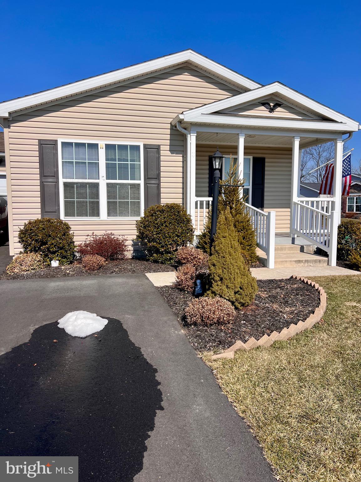 Welcome to 113 Eagles Watch S located in the Spring Valley Village community. This residence offers one-floor living with an open floor plan that includes a living room, dining area, and kitchen with counter seating.

The kitchen provides access to a spacious laundry room, which leads to the oversized attached garage.

The primary bedroom features a walk-in closet and private full bathroom. An additional bedroom and full hall bathroom complete the interior layout.

Spring Valley Village is an age-restricted community that offers amenities including walking trails and a clubhouse.

This home is move-in ready.