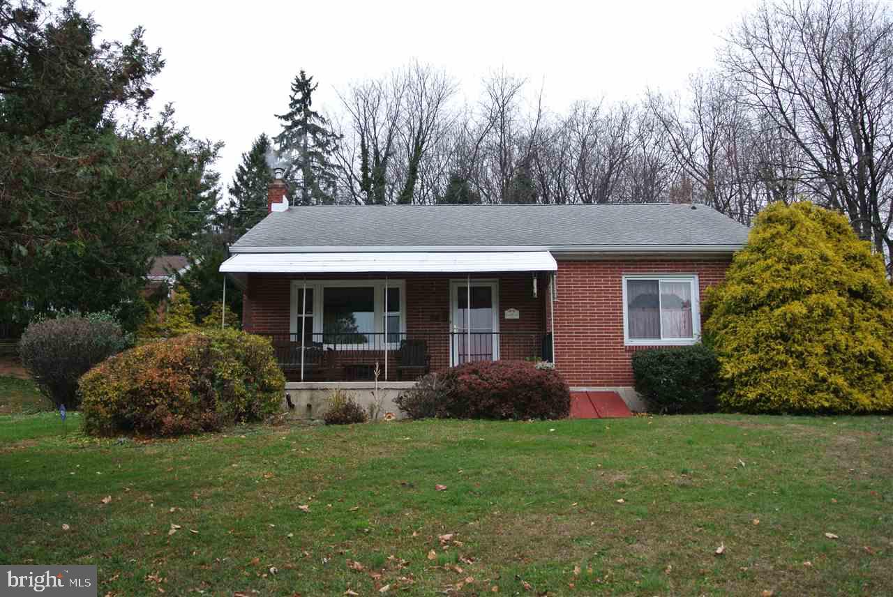 Well built all brick ranch home on over a 1/2 acre lot. This home offers 3 bedrooms, one bath, maintenance free exterior, replacement windows, beautiful oak hardwood flooring and has been recently painted. Enjoy the private back yard or the beautiful view from your front porch. Own your home for less than it would cost to rent.